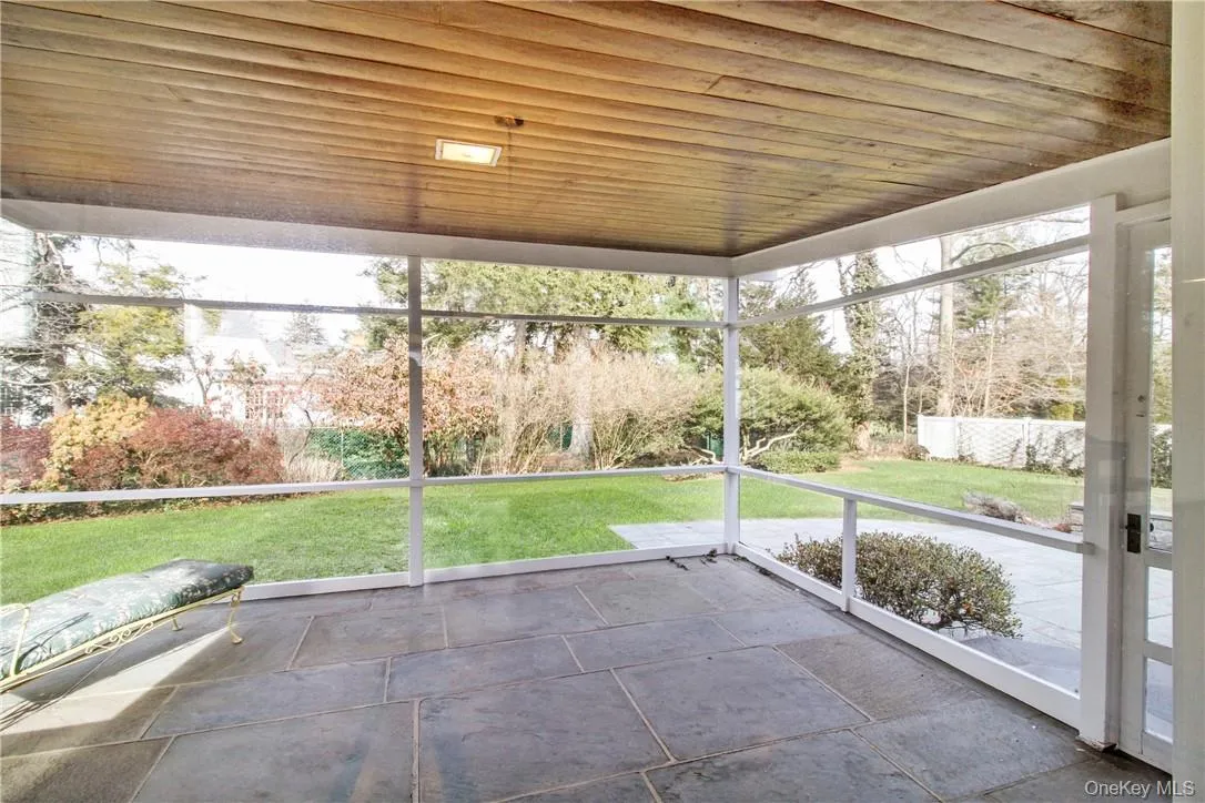 Covered screened porch accessed from great room and opening to yard. Photos taken when house was empty prior to occupancy. Covered screened porch accessed from great room and opening to yard. Photos taken when house was empty prior to occupancy.