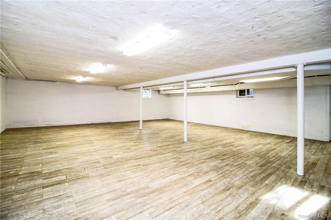 Large open space in basement with access to yard. Photos taken when house was empty prior to occupancy. Large open space in basement with access to yard. Photos taken when house was empty prior to occupancy.