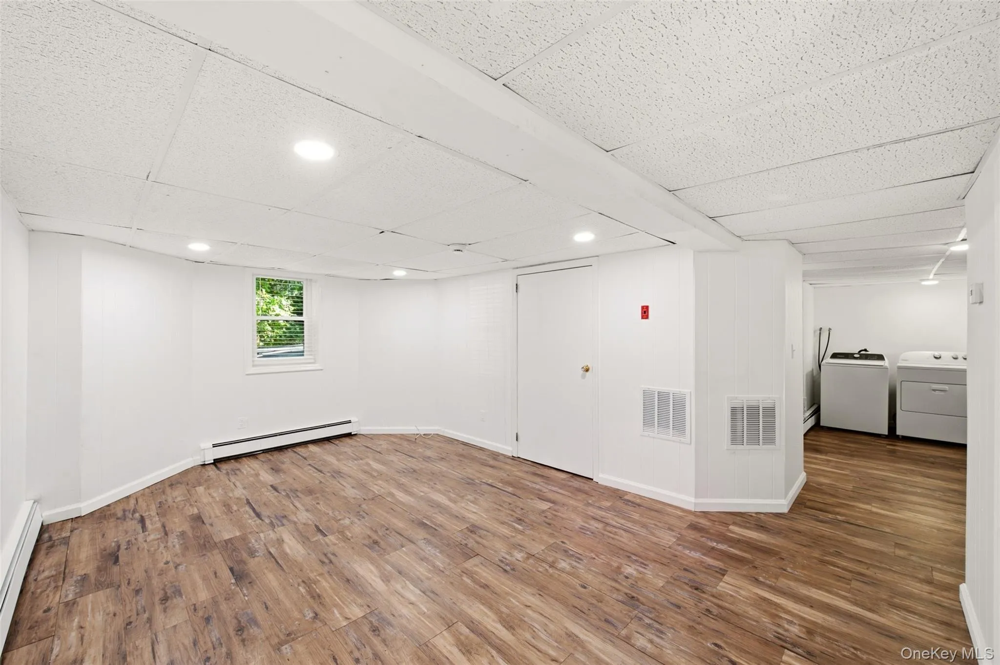 Lower level with outside entrance and recreation space Lower level with outside entrance and recreation space