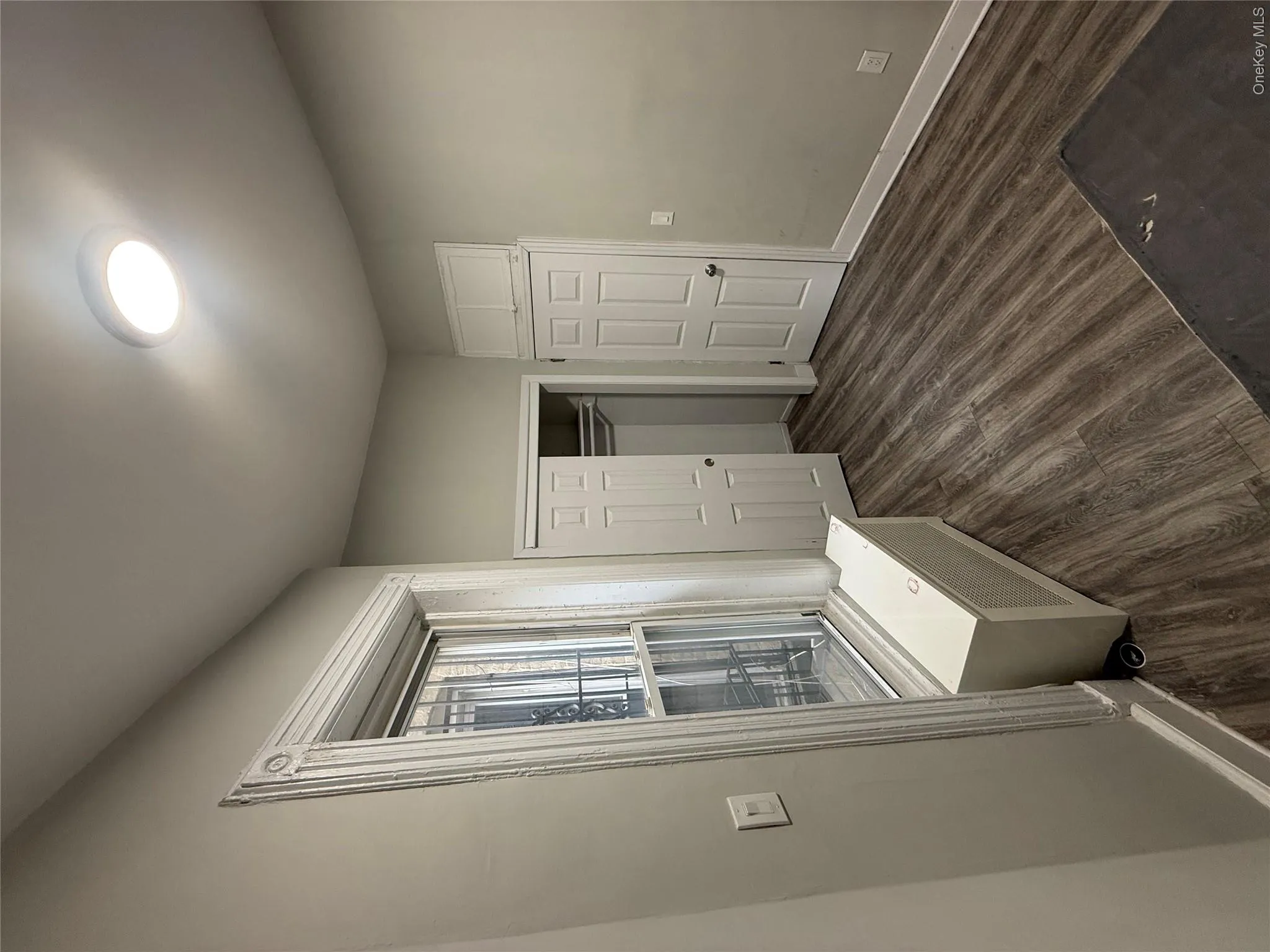 Mudroom with dark wood-style flooring and baseboards Mudroom with dark wood-style flooring and baseboards