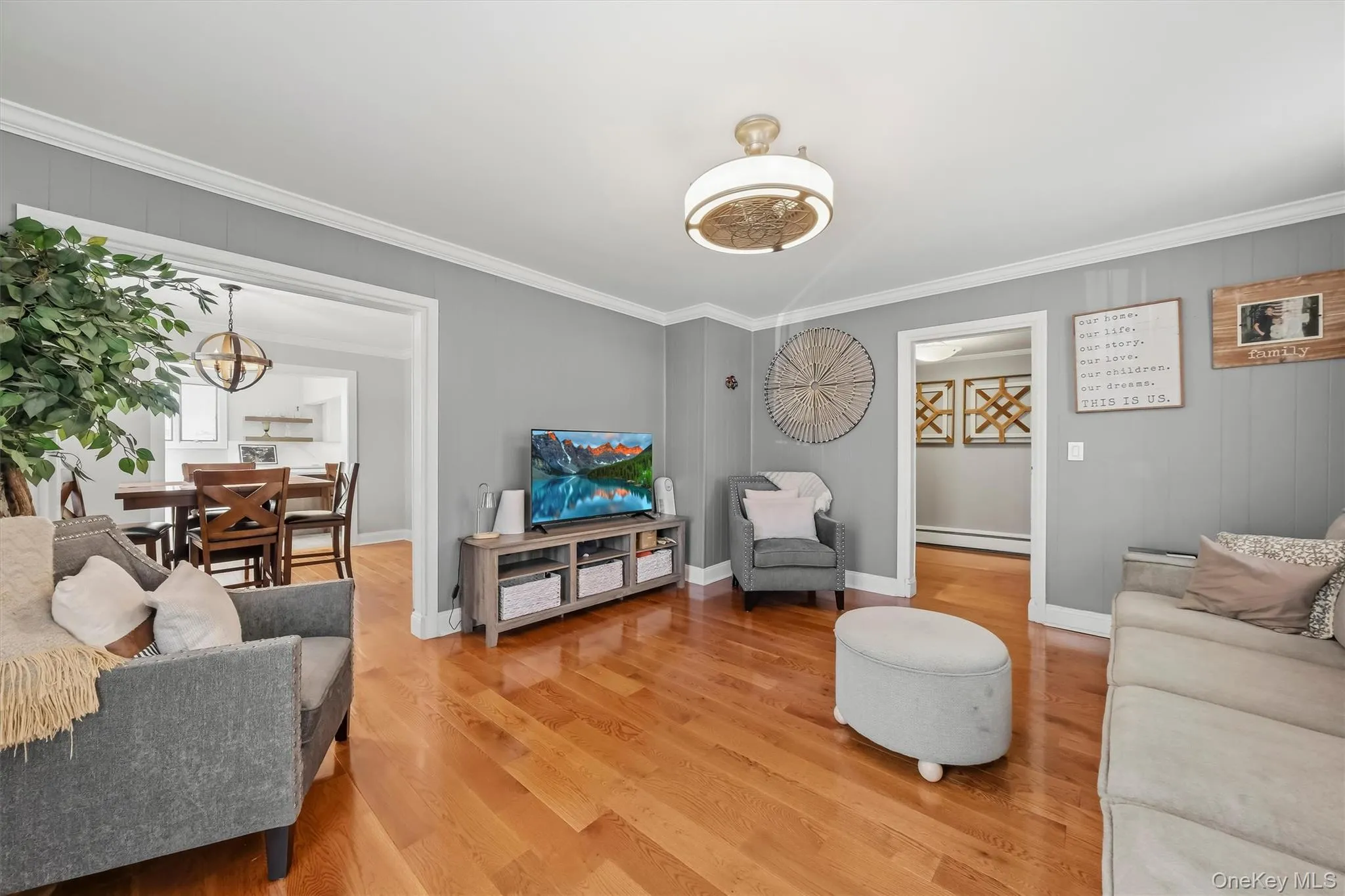 Spacious and sunlit living room highlighted by rich hardwood flooring and a comfortable layout for everyday living. Spacious and sunlit living room highlighted by rich hardwood flooring and a comfortable layout for everyday living.