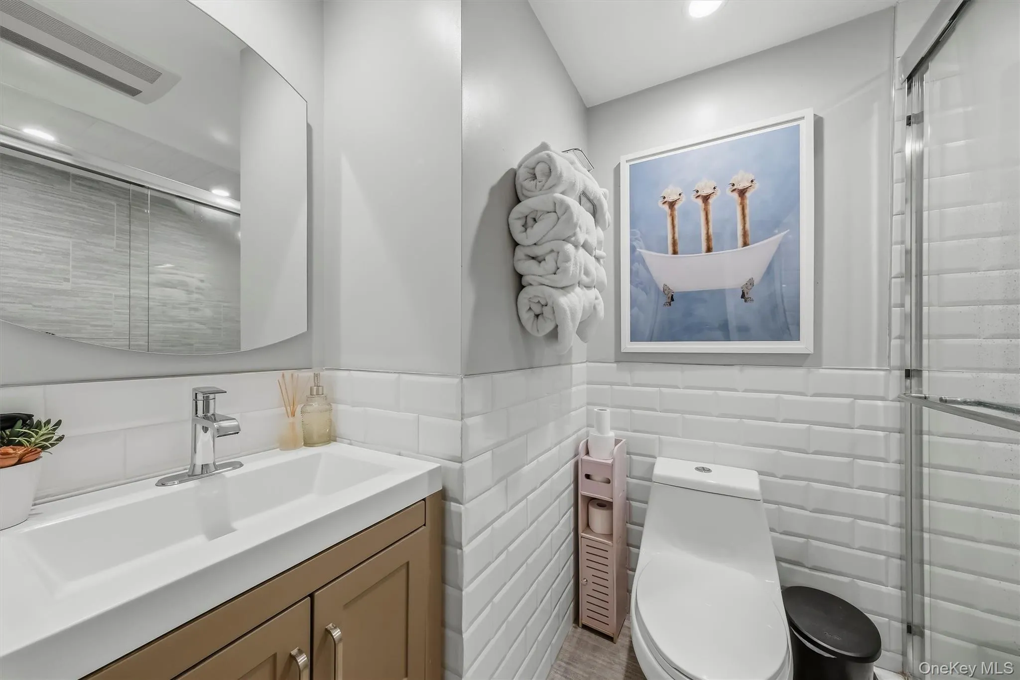 Chic, spa-like bathroom showcasing contemporary finishes, clean lines, and a bright, serene atmosphere. Chic, spa-like bathroom showcasing contemporary finishes, clean lines, and a bright, serene atmosphere.