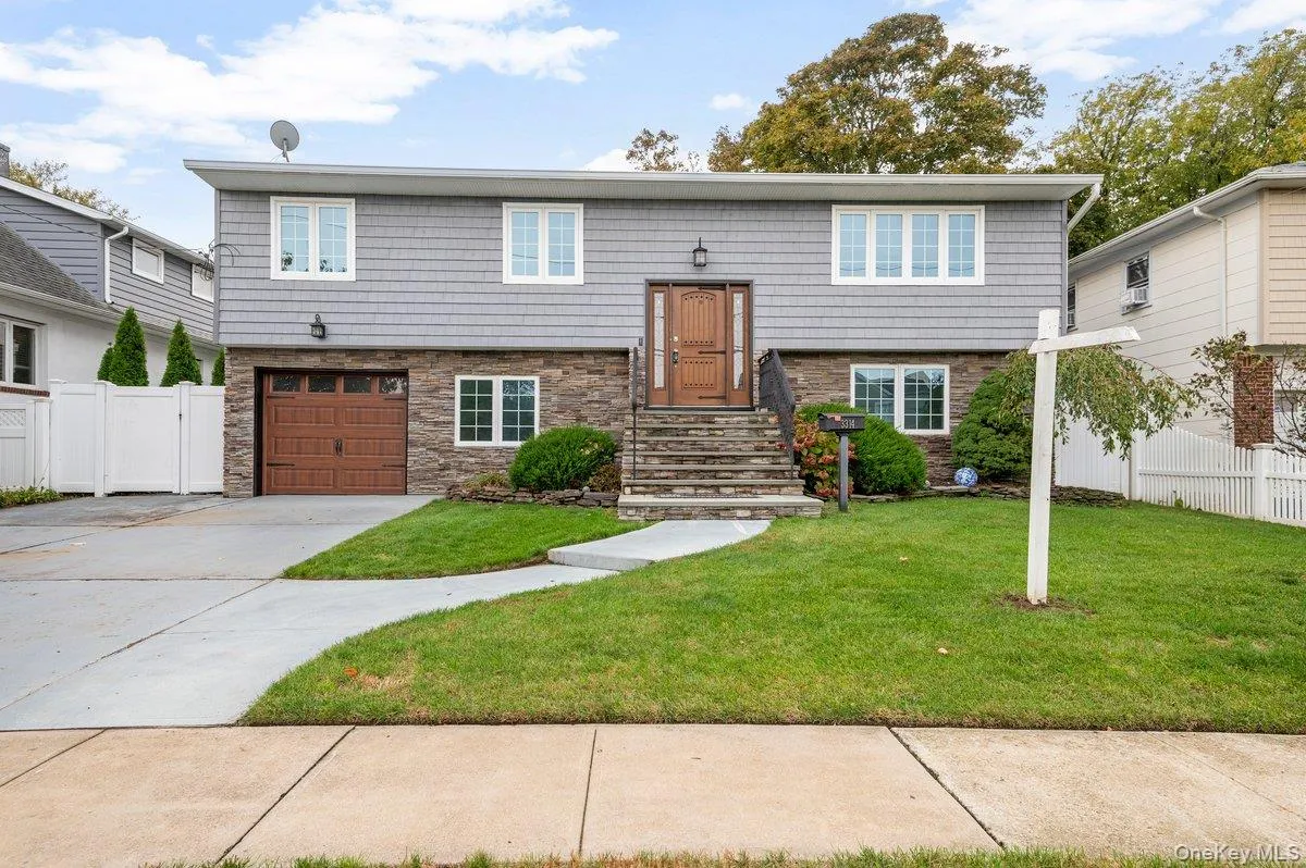 Remodeled Front With Stone, Vinyl Siding, Custom Doors. Remodeled Front With Stone, Vinyl Siding, Custom Doors.