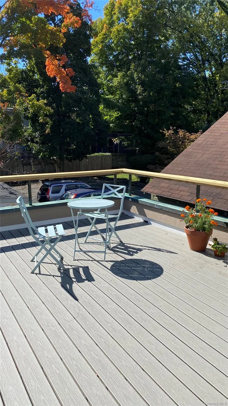 Expansive outdoor deck featuring composite decking and a sturdy railing Expansive outdoor deck featuring composite decking and a sturdy railing