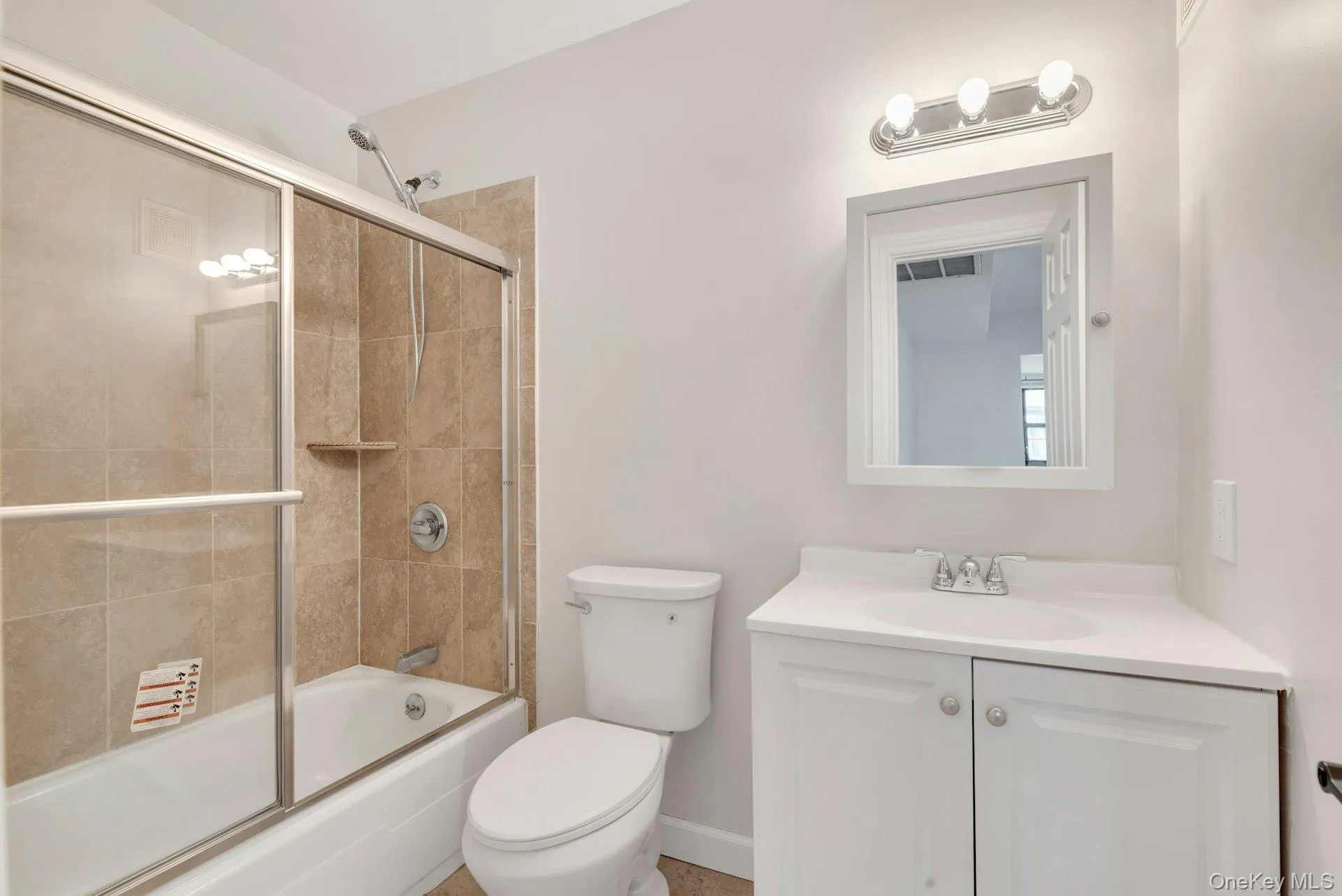 Bathroom with new Vanity, Medicine Cabinet, Toilet, and Lighting. Bathroom with new Vanity, Medicine Cabinet, Toilet, and Lighting.