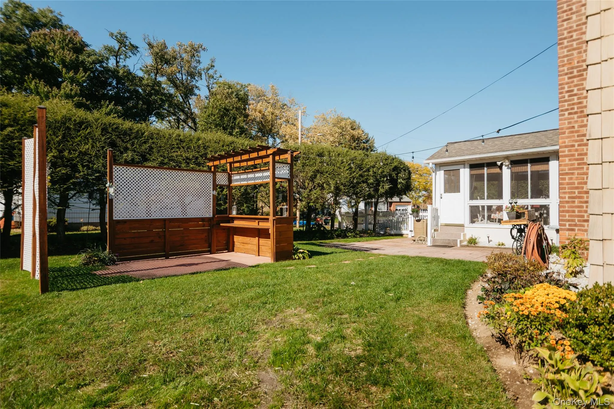 Ample rear yard with many tall hemlocks, nice privacy and 2 chestnut trees planted 3 years ago Ample rear yard with many tall hemlocks, nice privacy and 2 chestnut trees planted 3 years ago