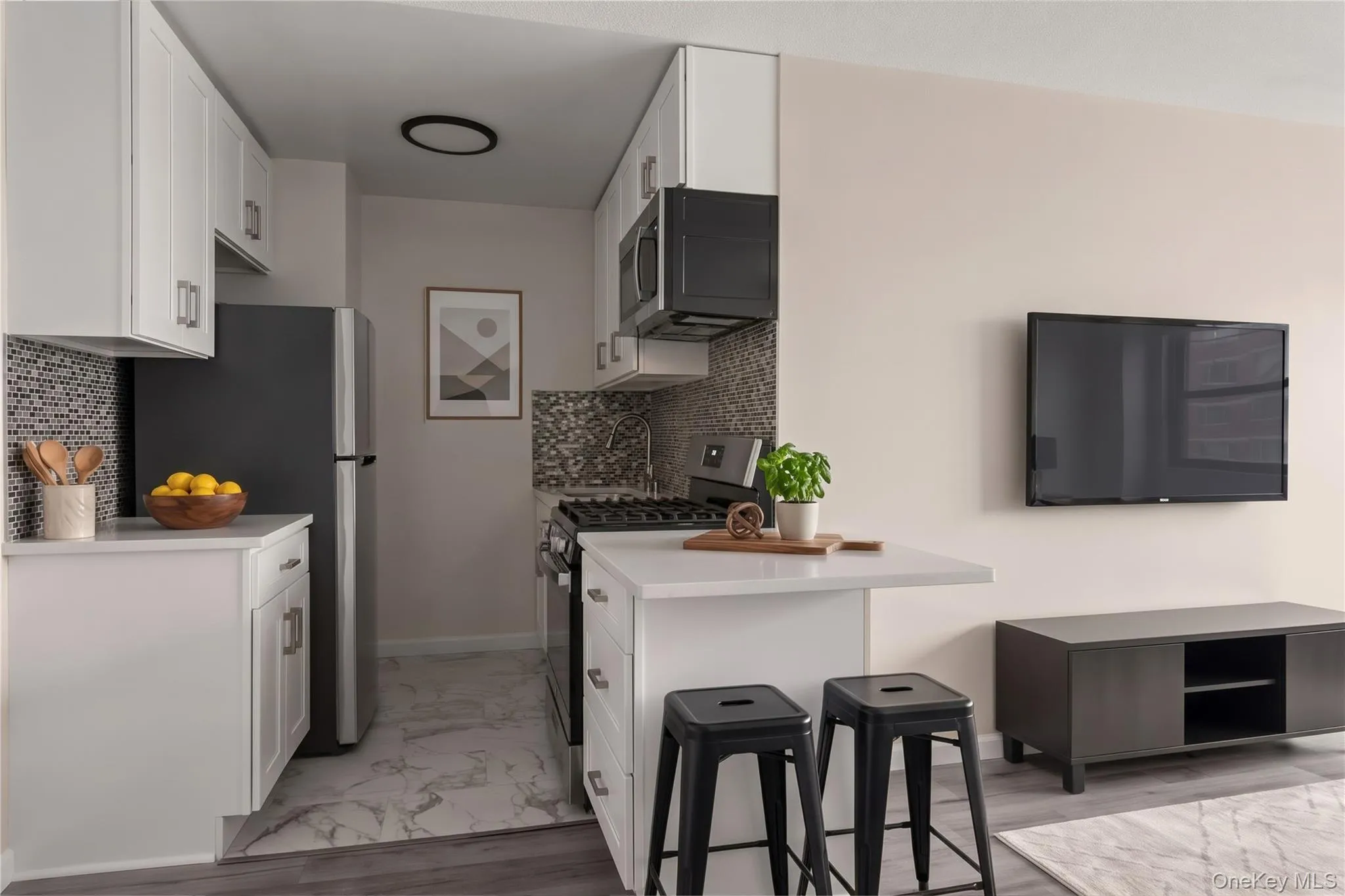 Fully renovated kitchen with new cabinets, quartz counter tops and stainless steel appliances Fully renovated kitchen with new cabinets, quartz counter tops and stainless steel appliances