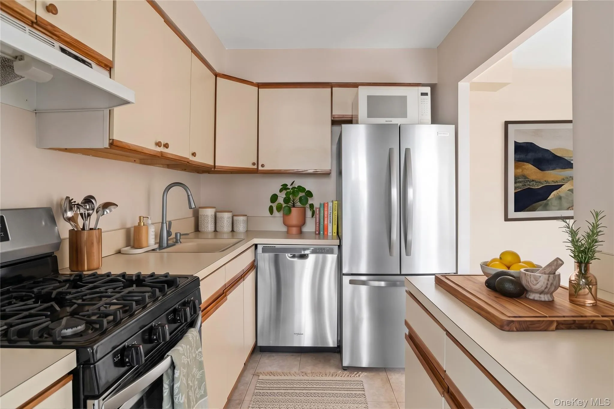 Galley kitchen with updated stainless steel appliances Galley kitchen with updated stainless steel appliances