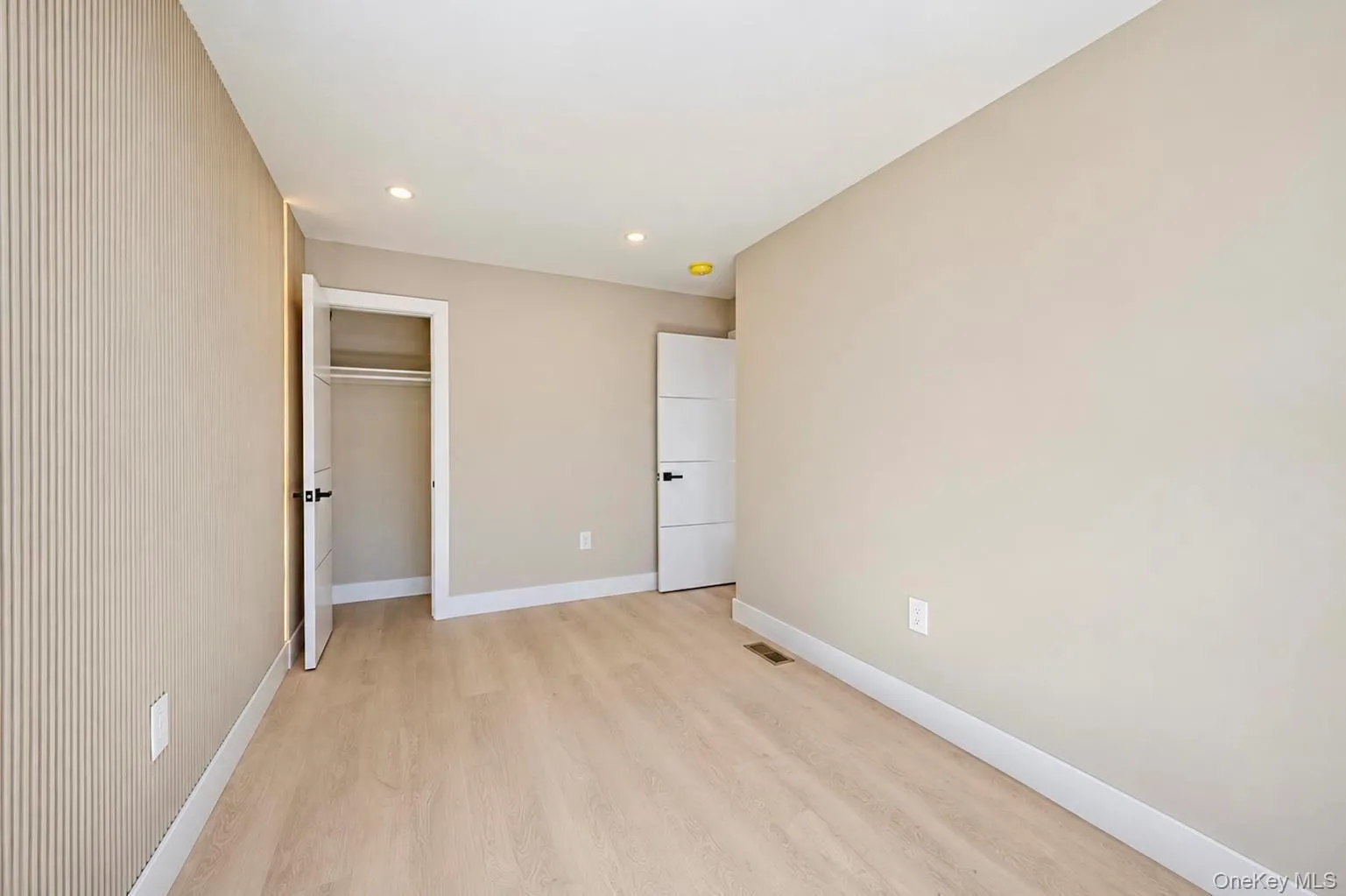 Light wood-finish flooring with recessed lightings Light wood-finish flooring with recessed lightings