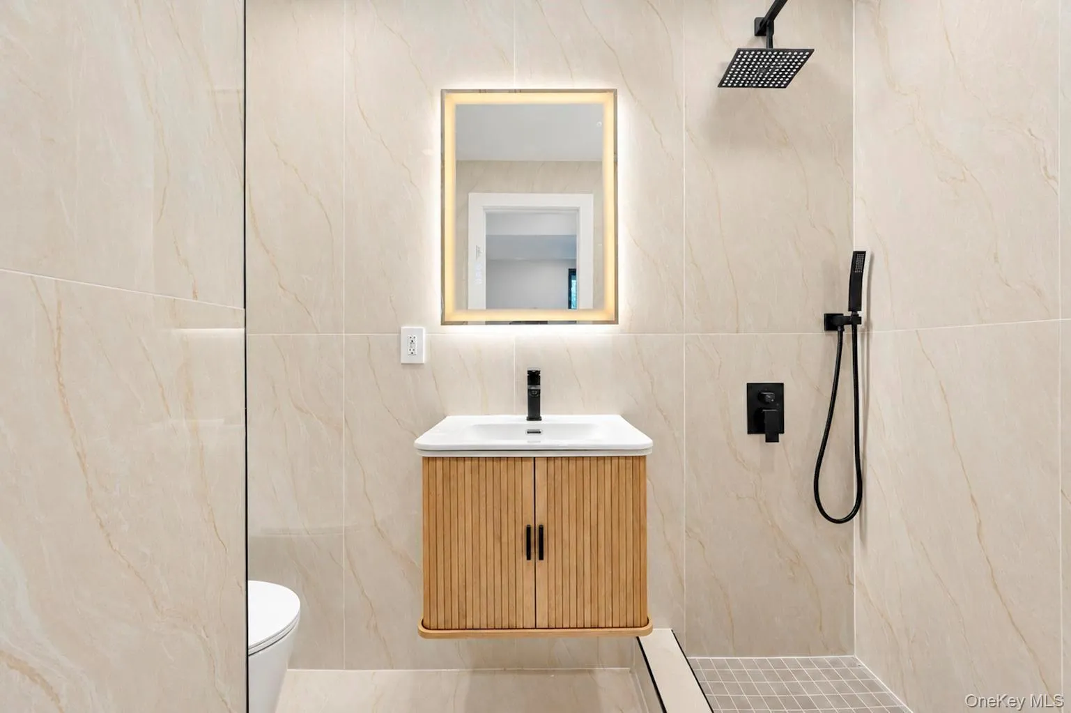 4th bathroom Integrated shower with matte black fixtures and a rain shower head. 4th bathroom Integrated shower with matte black fixtures and a rain shower head.