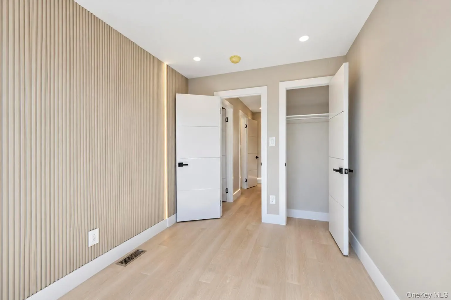 Recessed lighting, wood-finish flooring, two panel interior doors, and, a built-in closet with rod Recessed lighting, wood-finish flooring, two panel interior doors, and, a built-in closet with rod