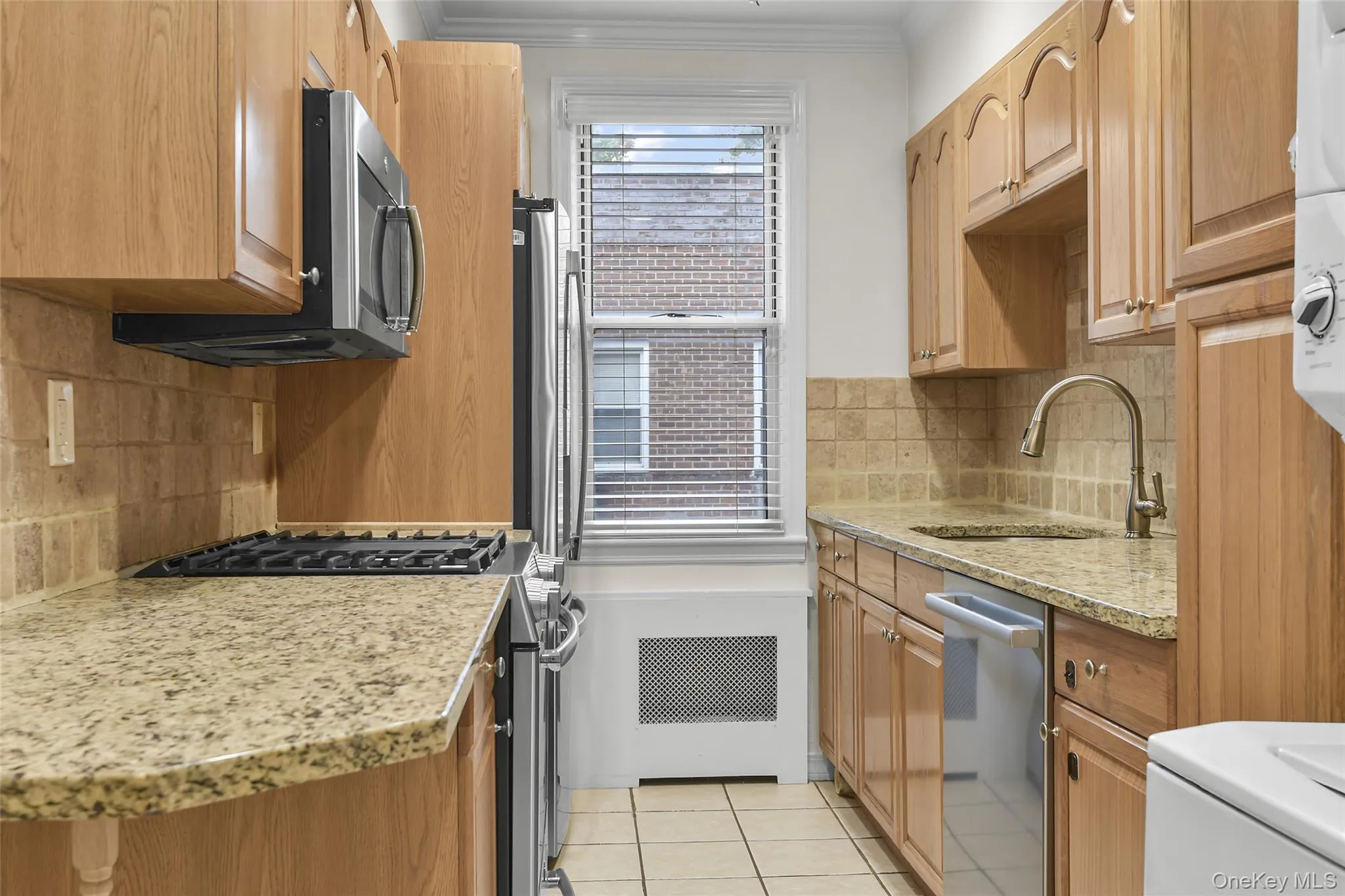Updated kitchen with new stainless steel appliances and laundry area. Updated kitchen with new stainless steel appliances and laundry area.
