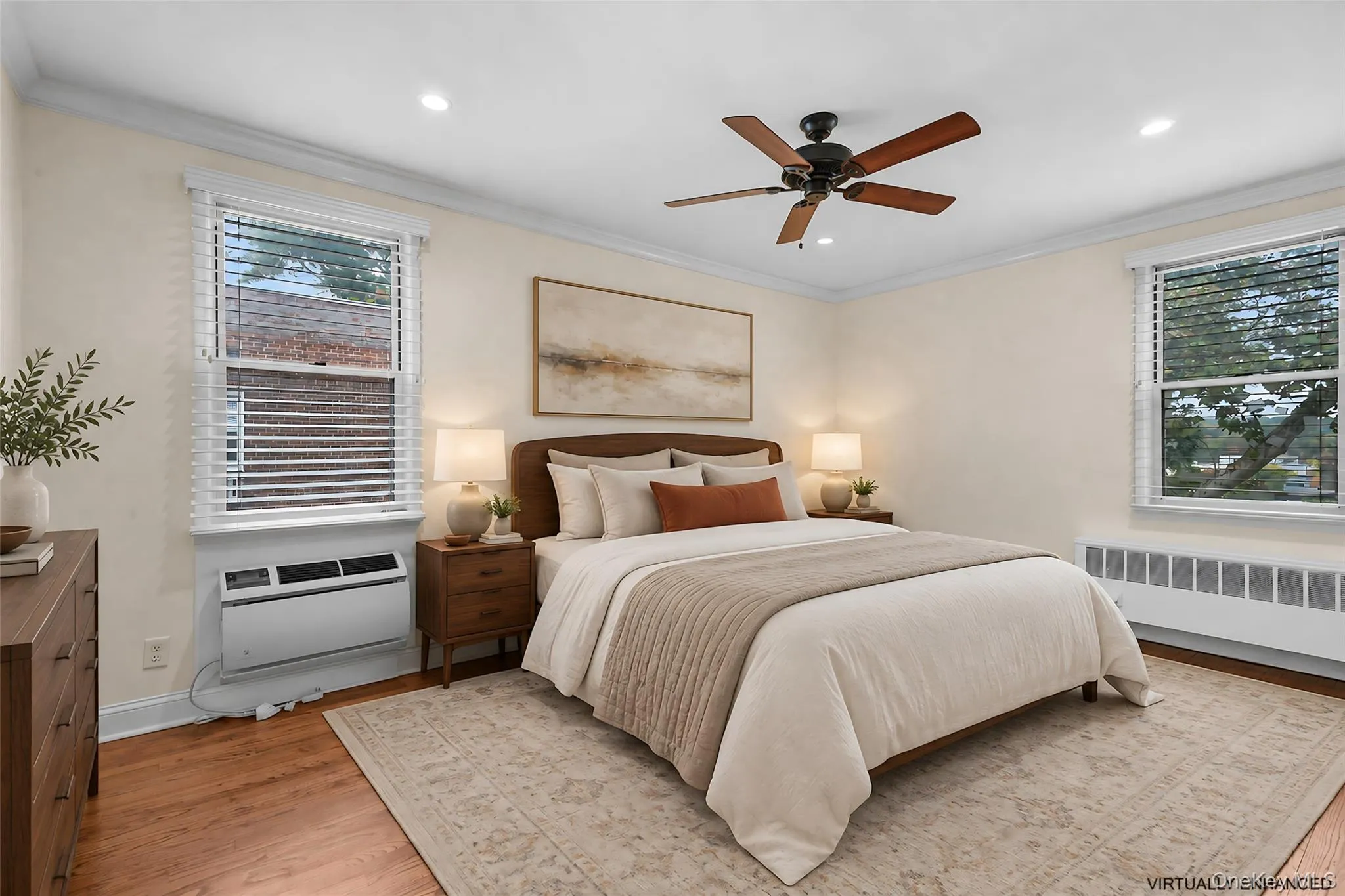 Primary bedroom with a large custom closet. Primary bedroom with a large custom closet.