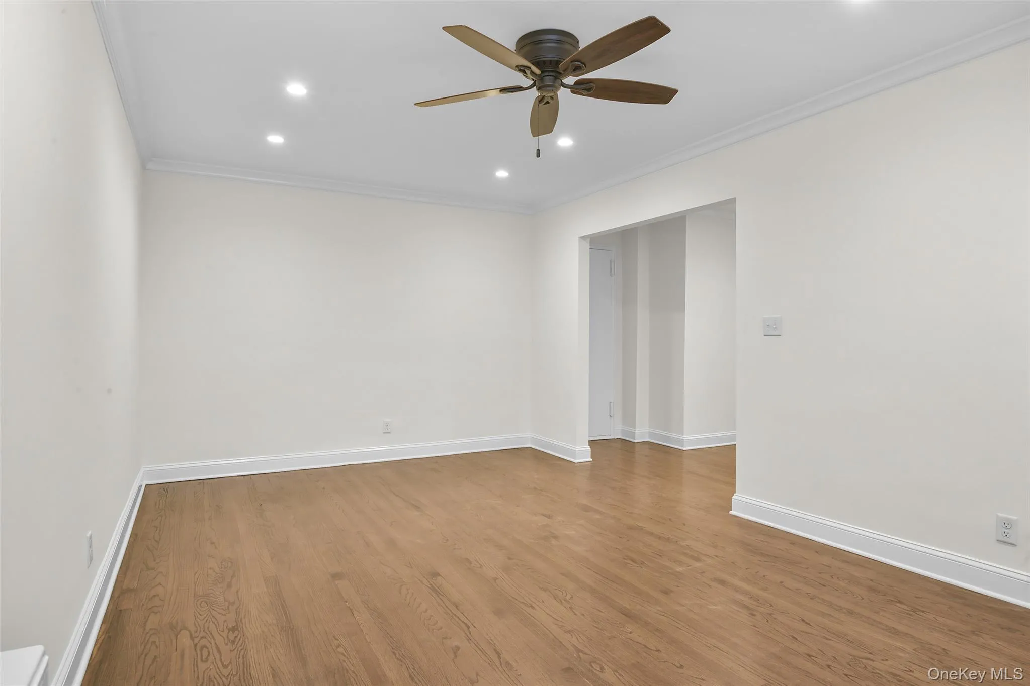Oversized living room with recessed lights and fan. Oversized living room with recessed lights and fan.