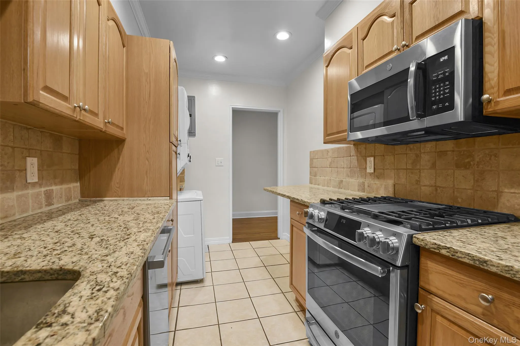Updated kitchen with new stainless steel appliances and laundry area. Updated kitchen with new stainless steel appliances and laundry area.