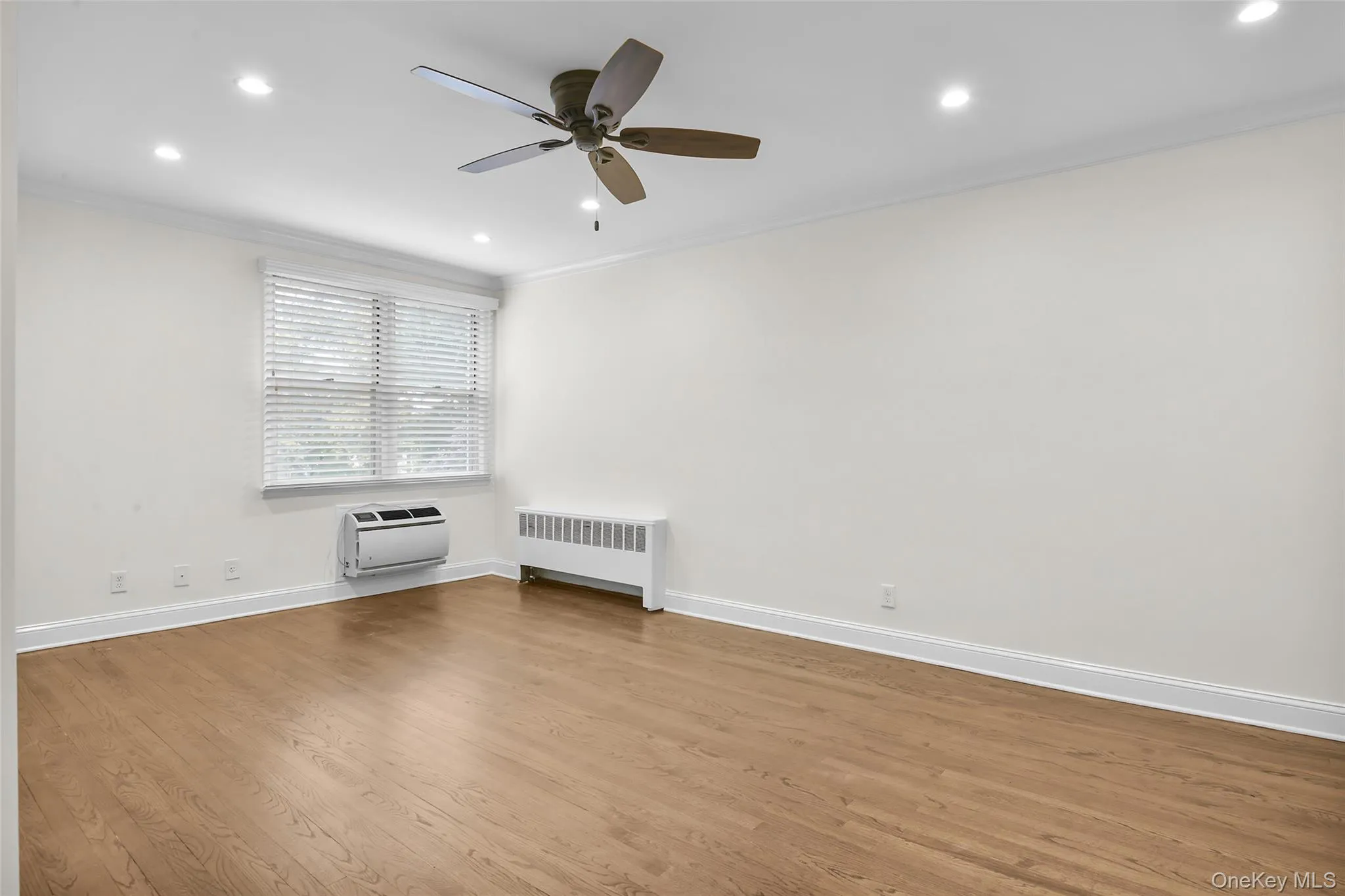 Oversized living room with recessed lights and fan. Oversized living room with recessed lights and fan.