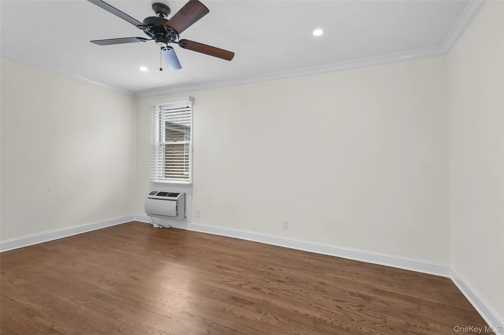 Primary bedroom with a large custom closet. Primary bedroom with a large custom closet.