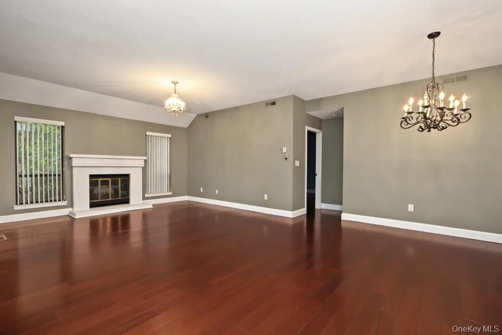 Living Room has a fireplace with mantle Living Room has a fireplace with mantle