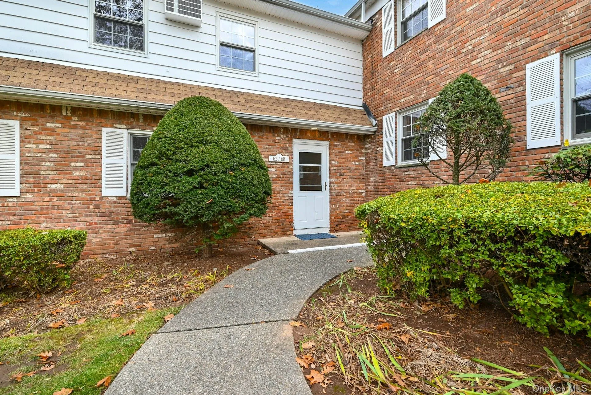 Property entrance with brick siding Property entrance with brick siding
