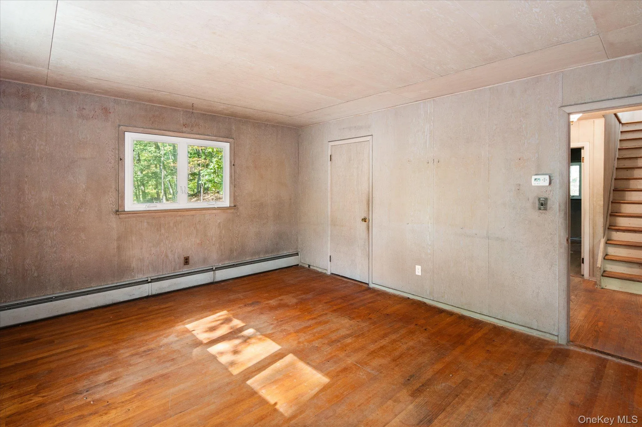Main level (3rd) bedroom with soft afternoon light Main level (3rd) bedroom with soft afternoon light