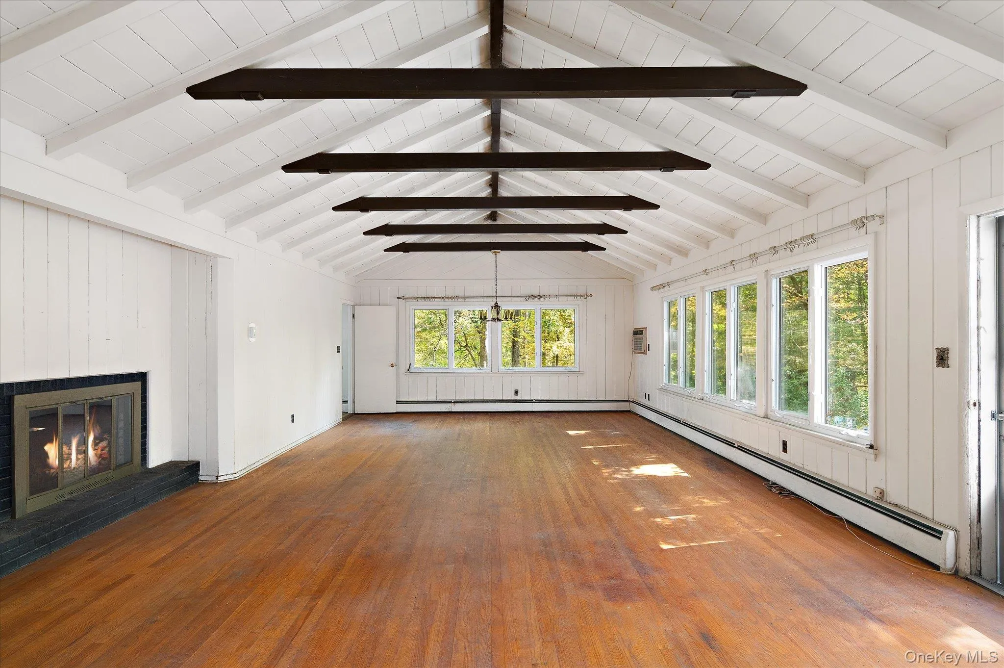 Beams overhead, fire on one end, woods on every side Beams overhead, fire on one end, woods on every side