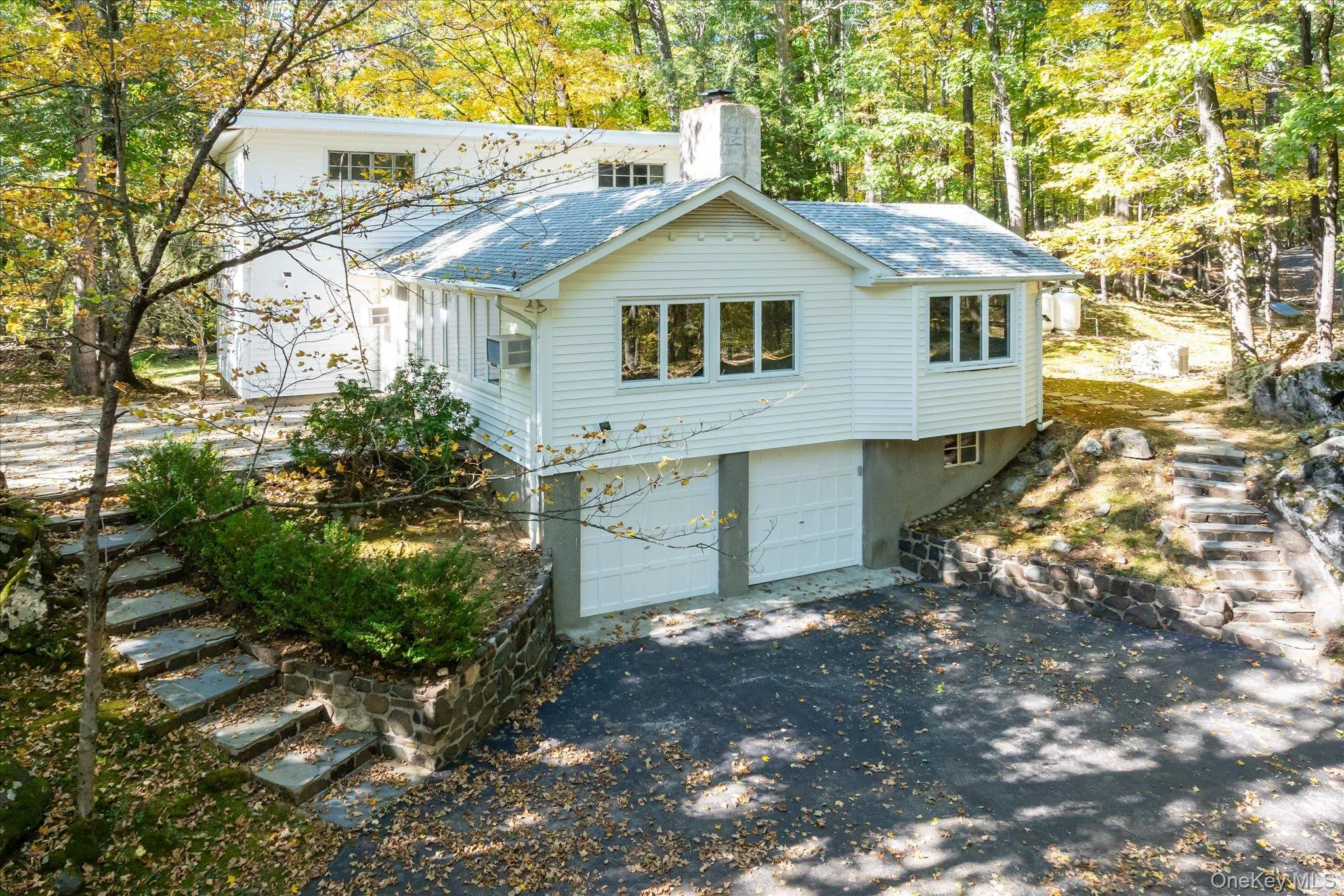 Stone steps rise from the drive to the front door Stone steps rise from the drive to the front door
