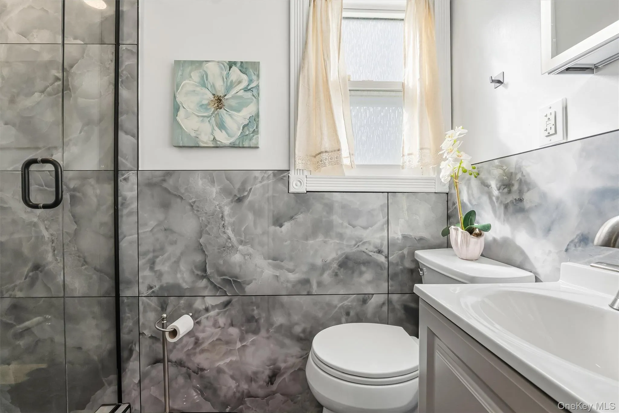A full bathroom on the first floor adds functionality and flexibility to the home's layout. A full bathroom on the first floor adds functionality and flexibility to the home's layout.
