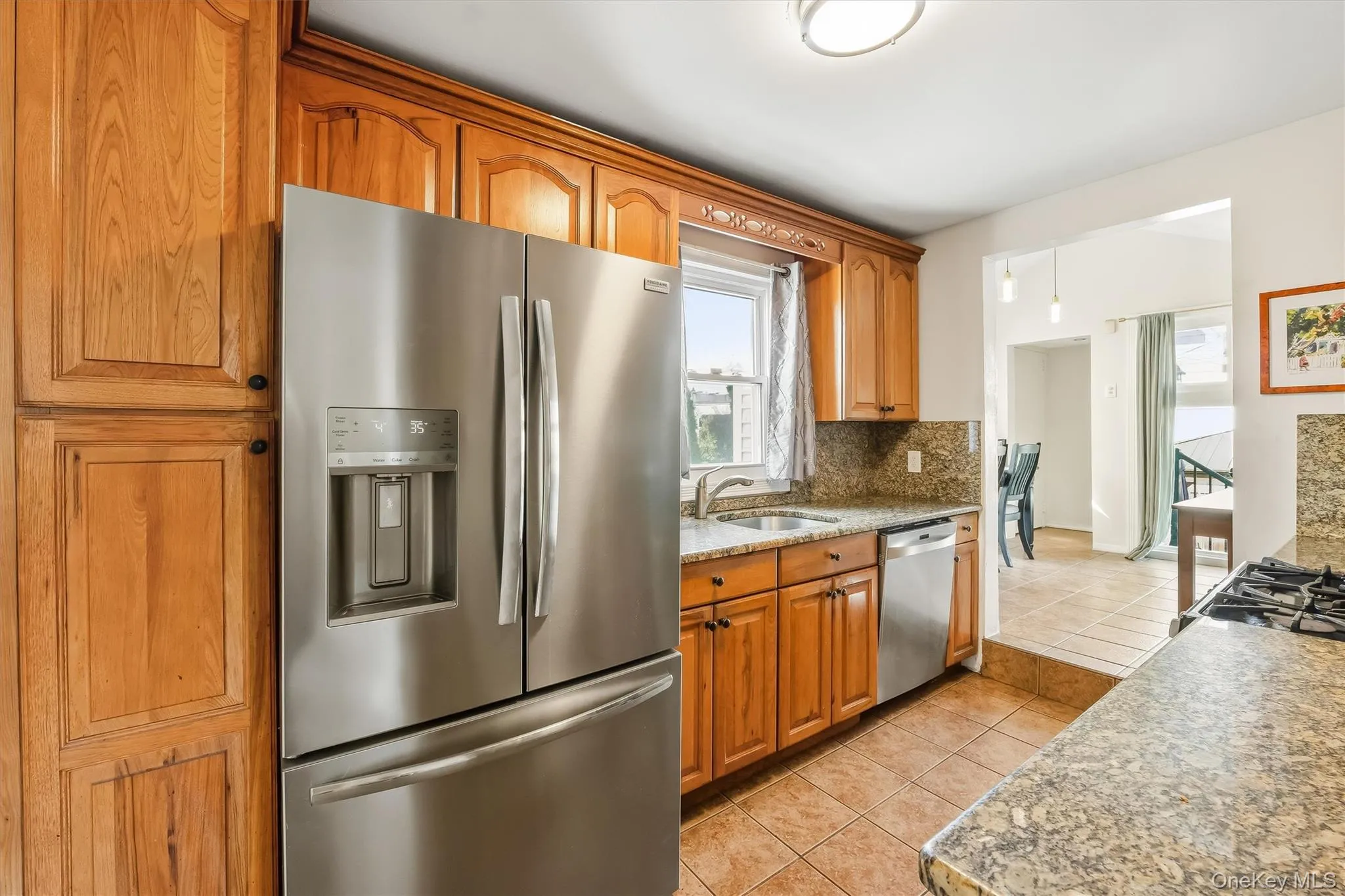 Warm wood cabinetry and granite surfaces bring traditional character to this thoughtfully appointed space. Warm wood cabinetry and granite surfaces bring traditional character to this thoughtfully appointed space.