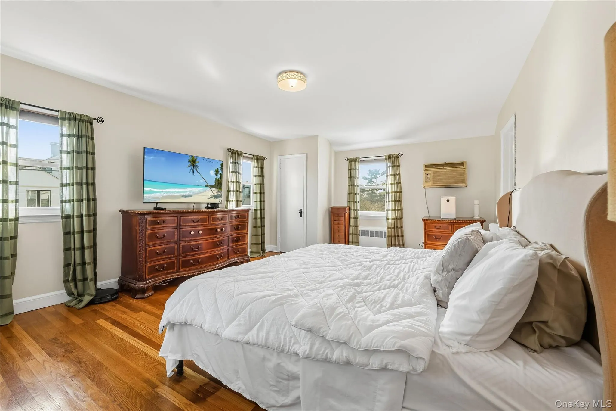 Generous space and practical storage make this primary bedroom an inviting retreat. Generous space and practical storage make this primary bedroom an inviting retreat.