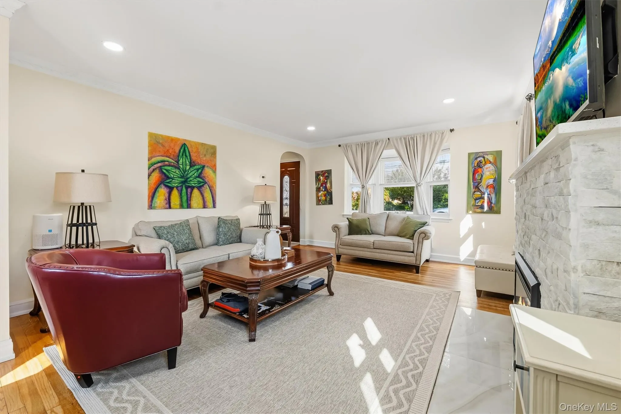 Generous space, recessed lighting, and refined architectural details give this living room its welcoming appeal. Generous space, recessed lighting, and refined architectural details give this living room its welcoming appeal.