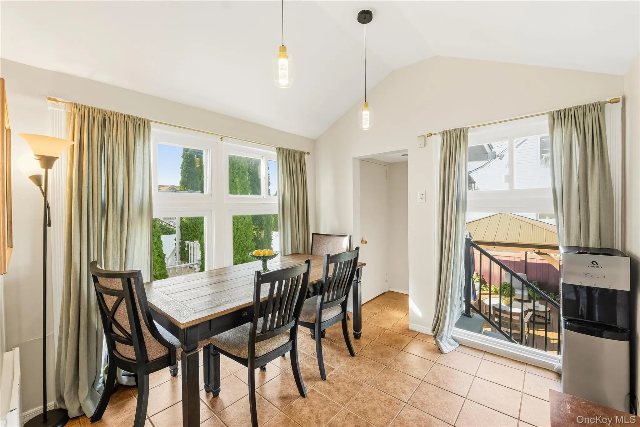 Vaulted ceilings and floor-to-ceiling windows showcase spectacular views, creating a stunning backdrop for everyday dining and elegant entertaining. Vaulted ceilings and floor-to-ceiling windows showcase spectacular views, creating a stunning backdrop for everyday dining and elegant entertaining.