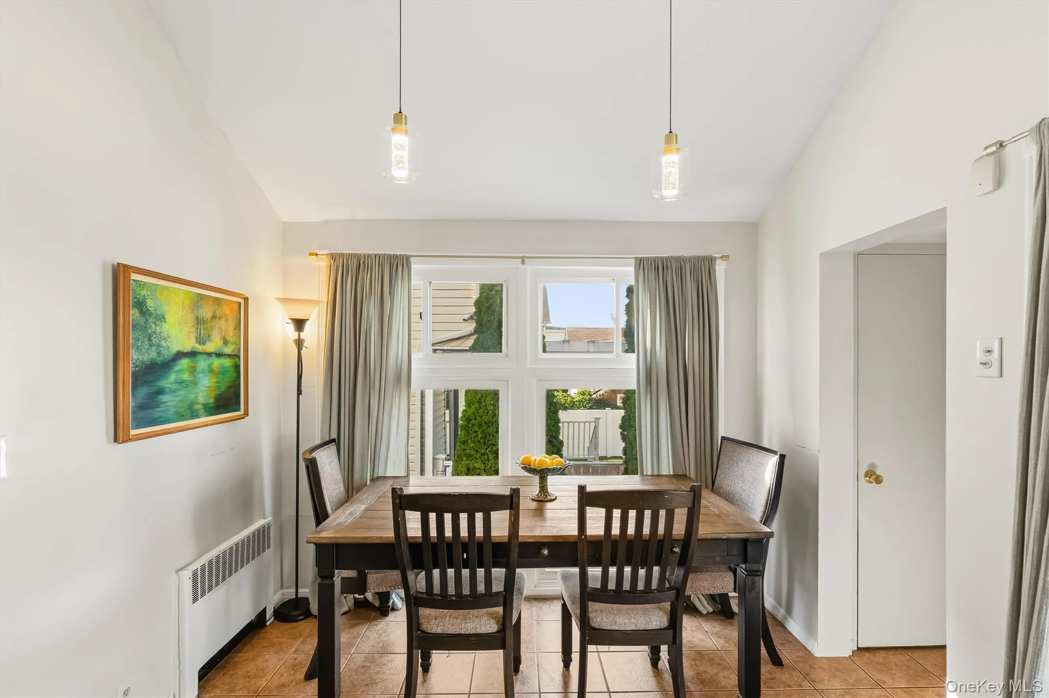 Expansive windows bring the surrounding scenery into this bright, inviting dining area. Expansive windows bring the surrounding scenery into this bright, inviting dining area.