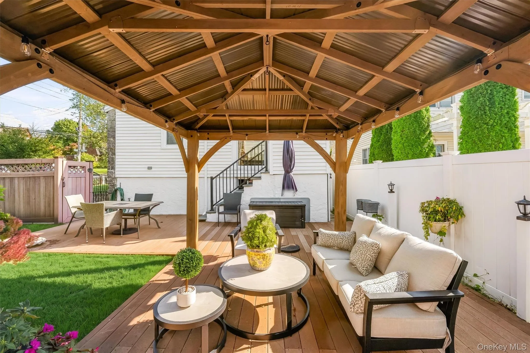 Thoughtfully arranged seating and dining areas make the backyard ideal for entertaining. Thoughtfully arranged seating and dining areas make the backyard ideal for entertaining.