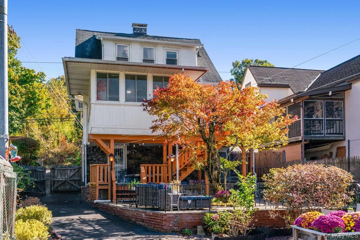 The backyard is a hidden oasis of multiple entertaining spaces and gardens. A Japanese maple is a showstopper. The backyard is a hidden oasis of multiple entertaining spaces and gardens. A Japanese maple is a showstopper.