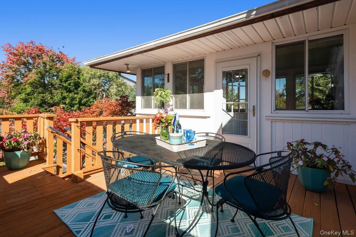 The back deck is located just off the sun porch and kitchen, making it perfect for alfresco cooking and dining. The back deck is located just off the sun porch and kitchen, making it perfect for alfresco cooking and dining.