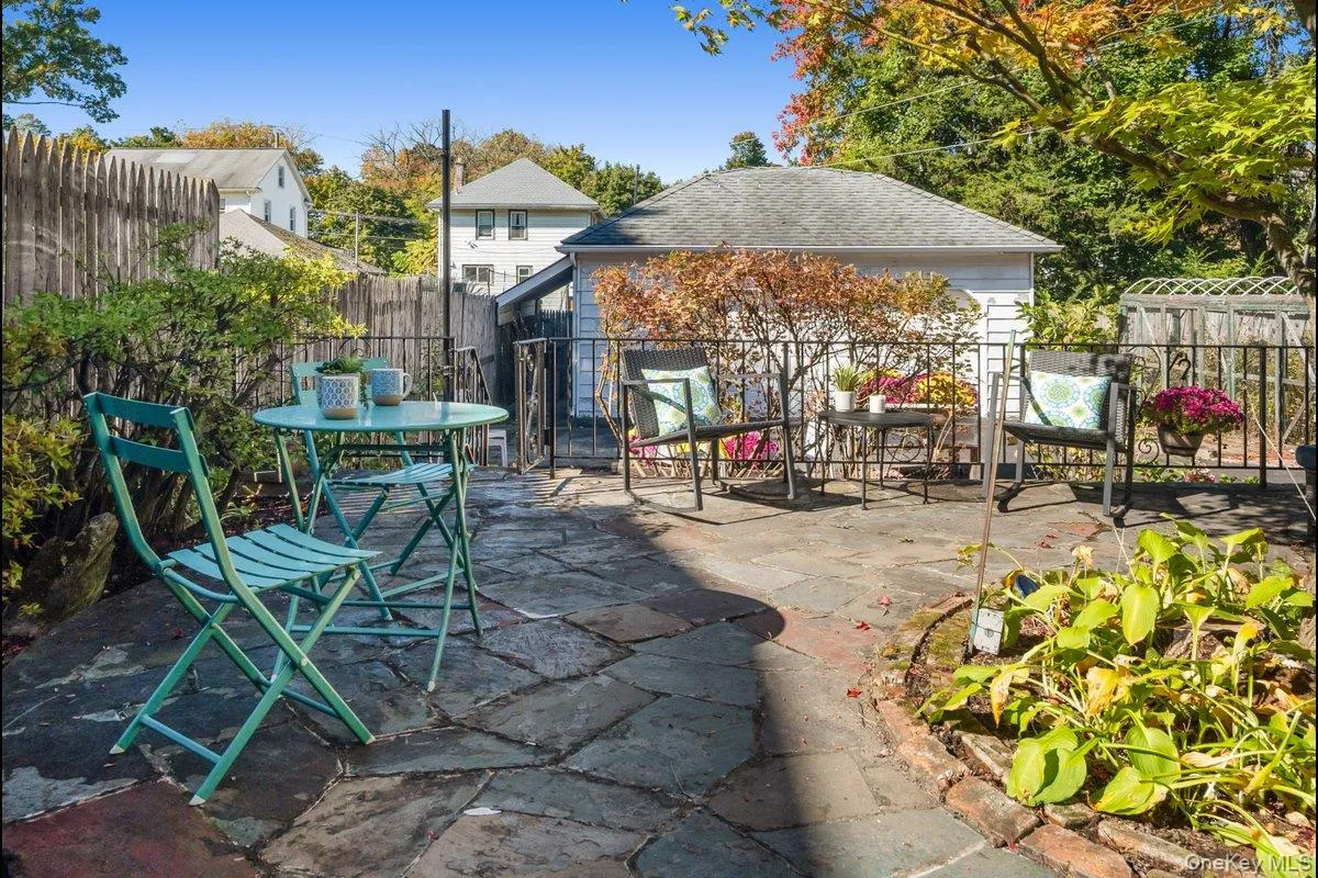 Multiple seating areas and lower garden access from the patio. Multiple seating areas and lower garden access from the patio.