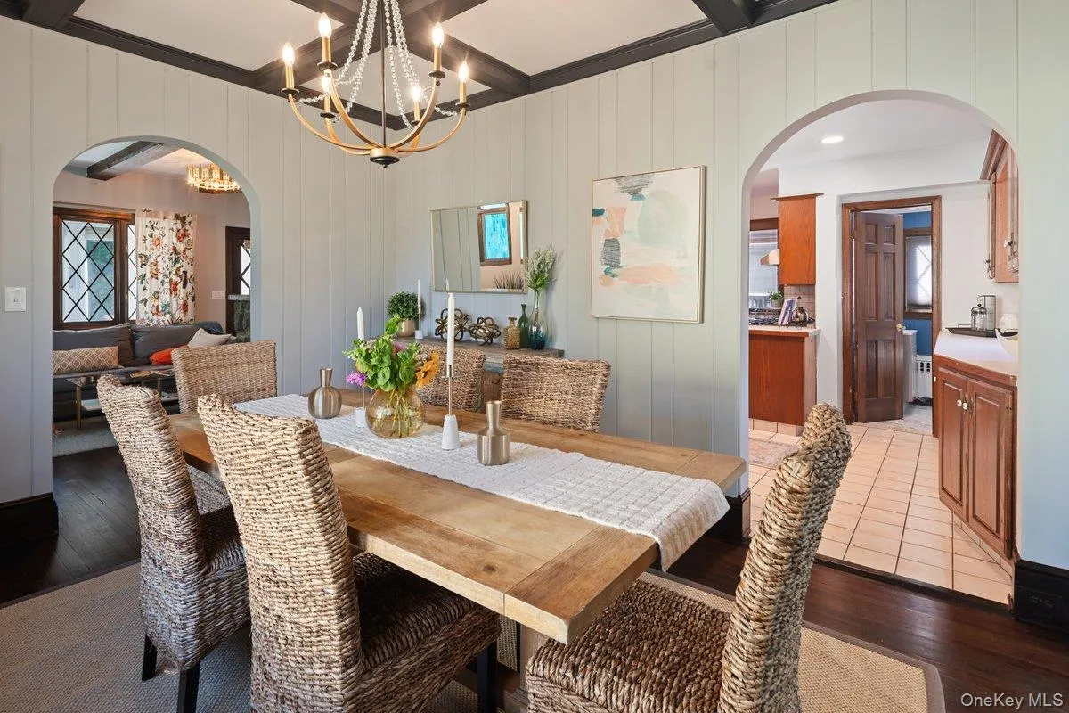 The generously sized dining room is connected to the kitchen and living room through arched doorways, creating a seamless flow. The generously sized dining room is connected to the kitchen and living room through arched doorways, creating a seamless flow.