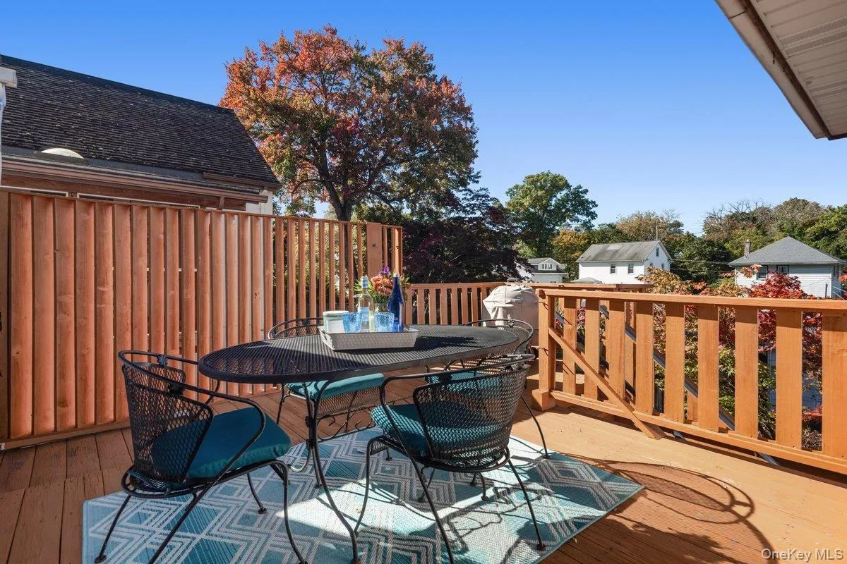 Privacy walls and scenic views enhance the charm of the back deck, while stairs lead you down to the lower patios and gardens.. Privacy walls and scenic views enhance the charm of the back deck, while stairs lead you down to the lower patios and gardens..