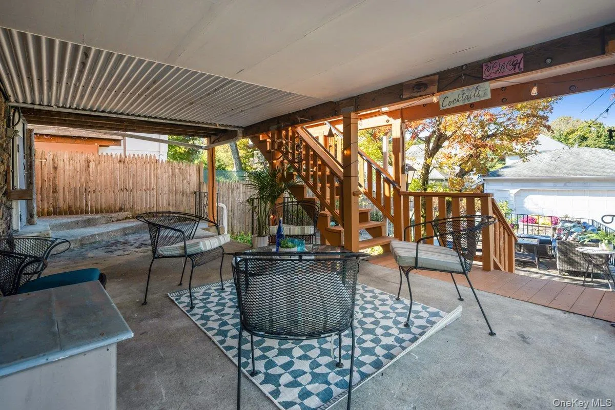 A covered patio is located under the deck and has access to the basement, offering another outdoor living space. A covered patio is located under the deck and has access to the basement, offering another outdoor living space.