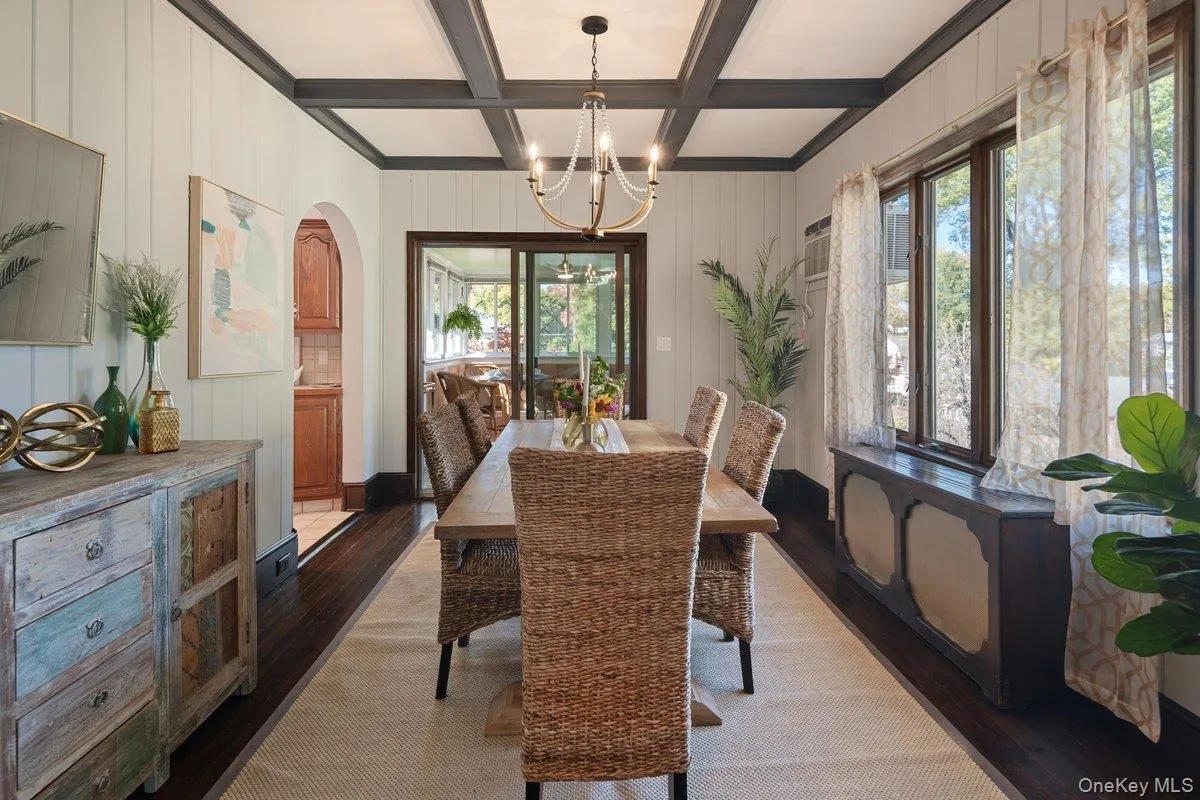 Sliding glass doors lead you into a three-season room off the dining room. Sliding glass doors lead you into a three-season room off the dining room.