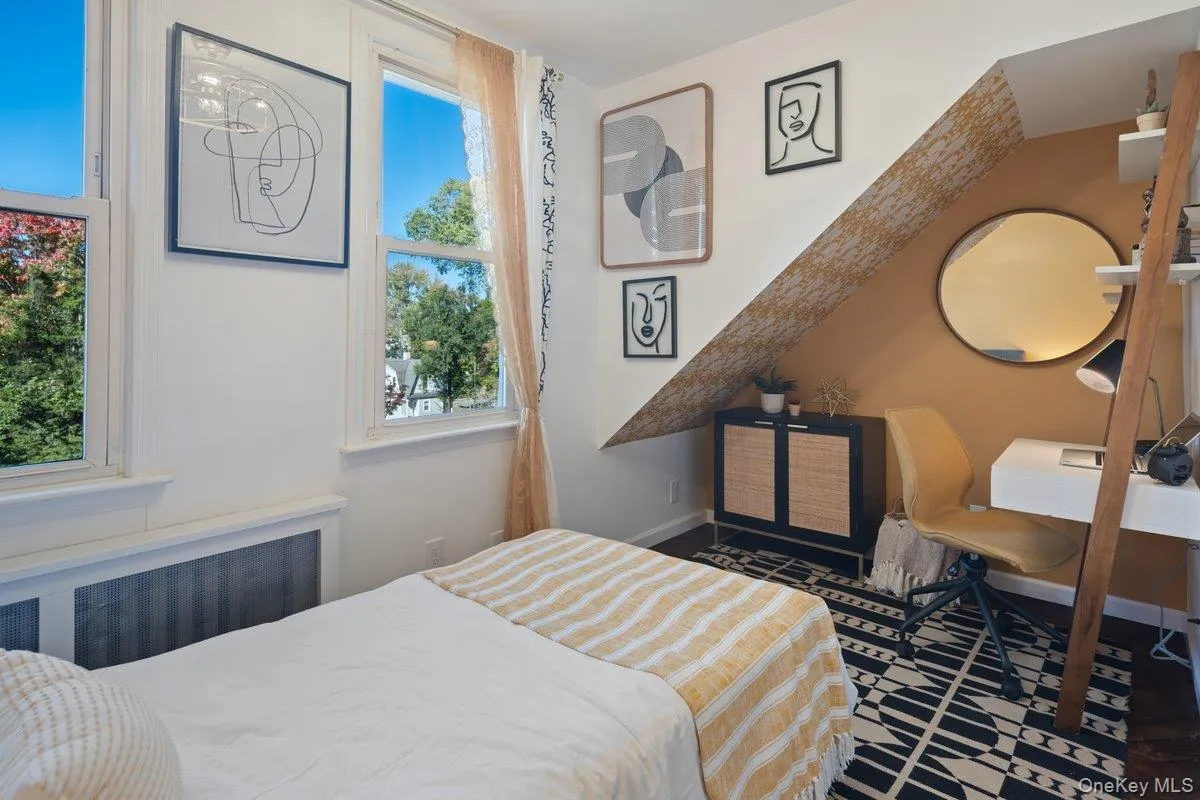 TThe novelty accent wall in the second bedroom adds character, with two closets and a new novelty ceiling fan completing the space. TThe novelty accent wall in the second bedroom adds character, with two closets and a new novelty ceiling fan completing the space.
