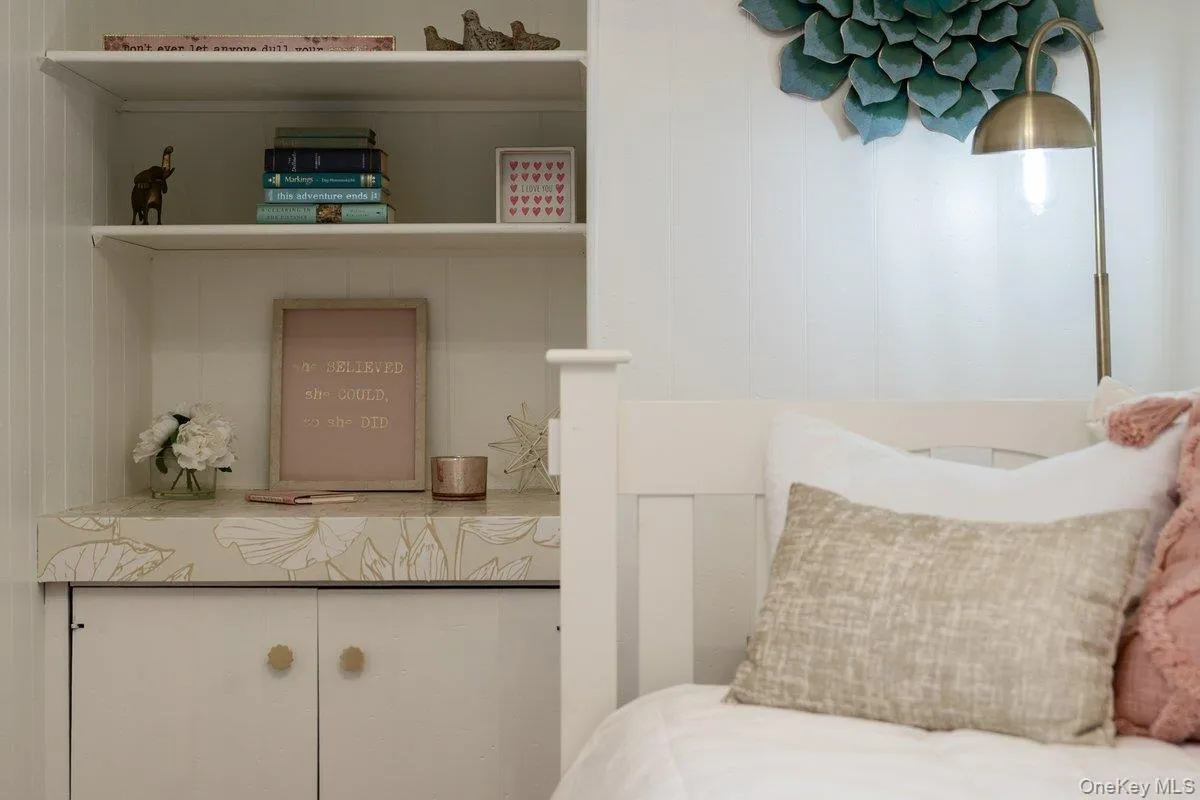 The built-in shelves and cabinet combine original charm with modern functionality. The built-in shelves and cabinet combine original charm with modern functionality.