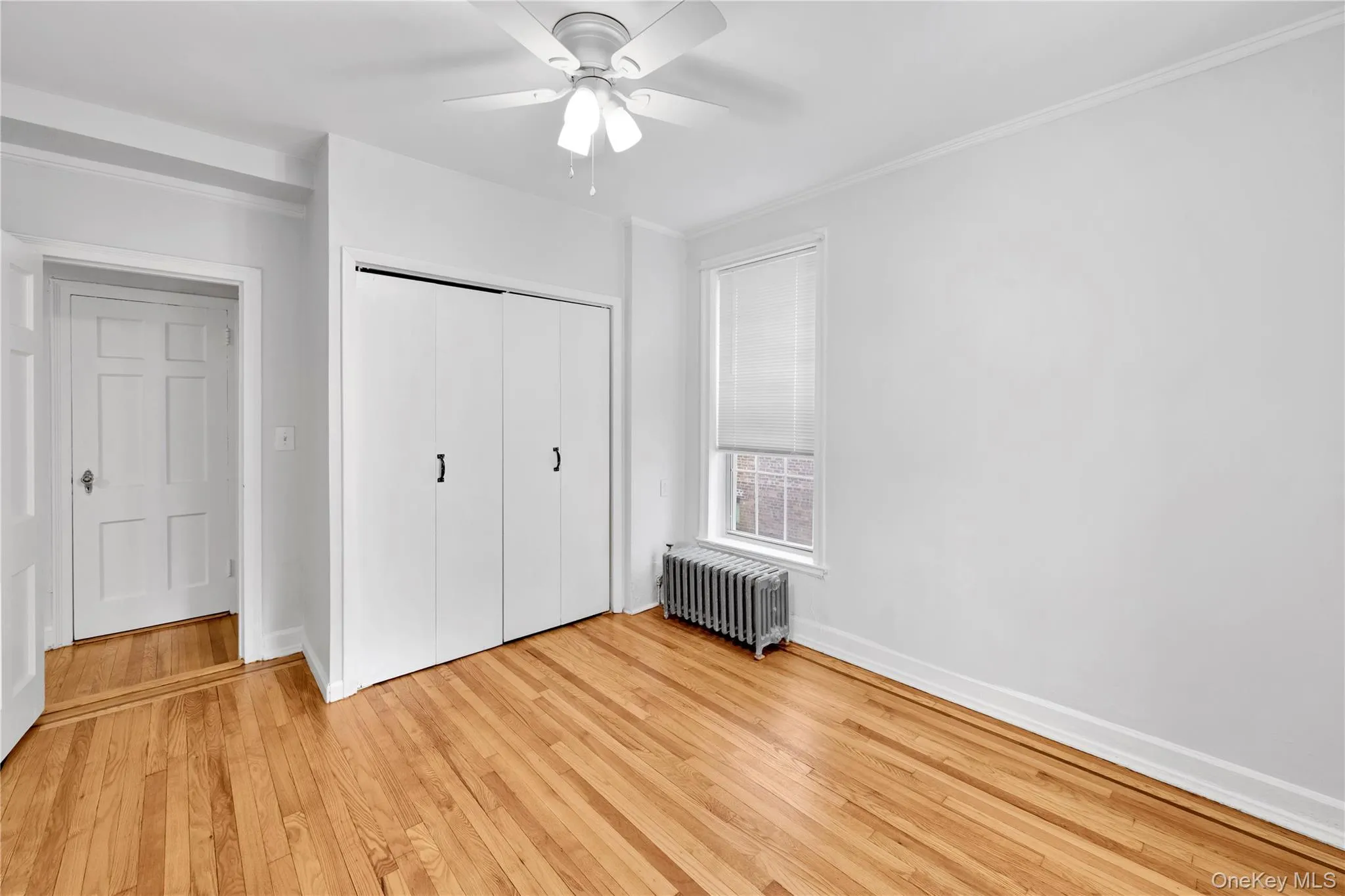 Bedroom with refinished hardwood floors and freshly painted Bedroom with refinished hardwood floors and freshly painted