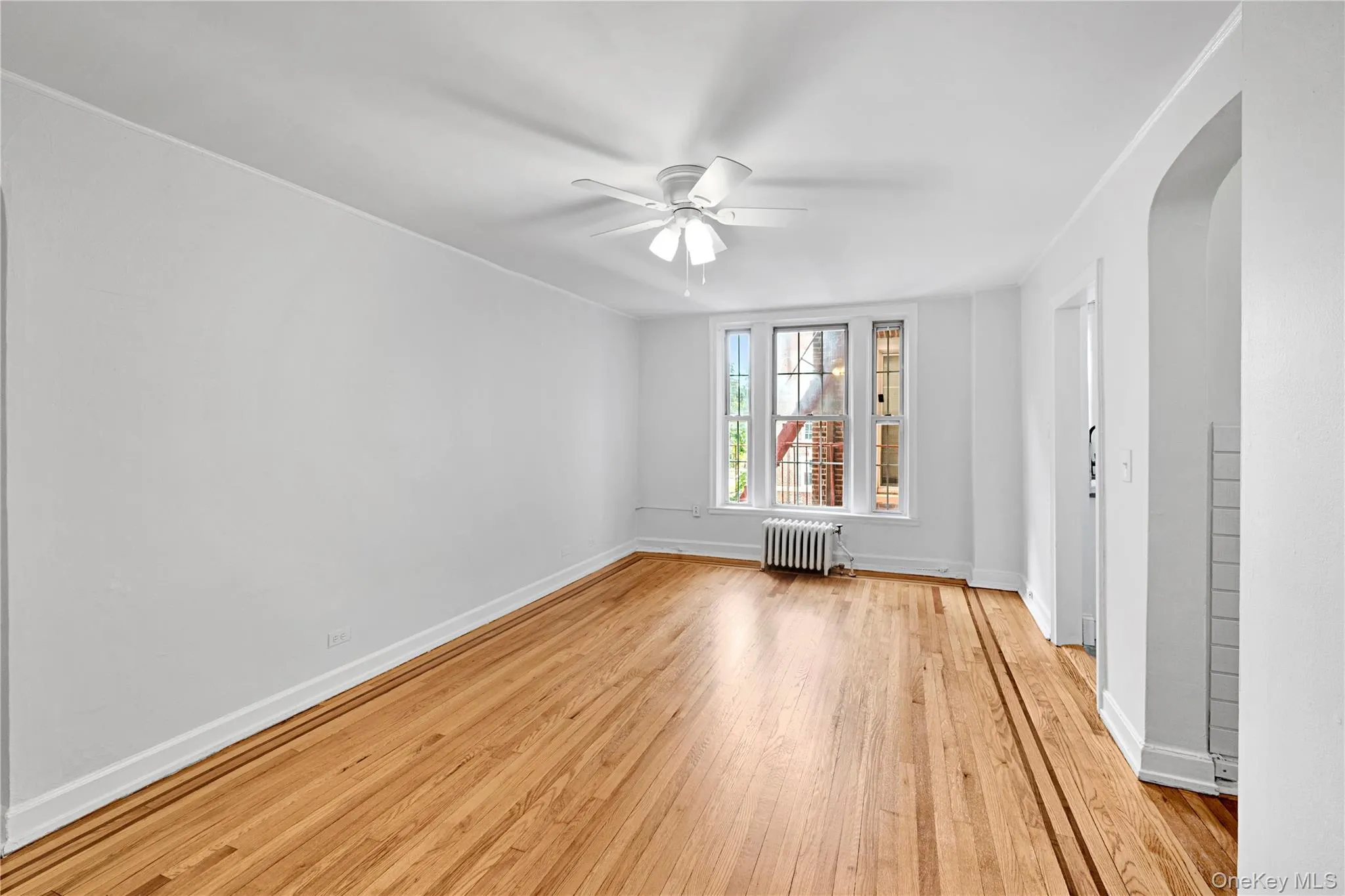 Living Room with refinished hardwood floors and freshly painted Living Room with refinished hardwood floors and freshly painted