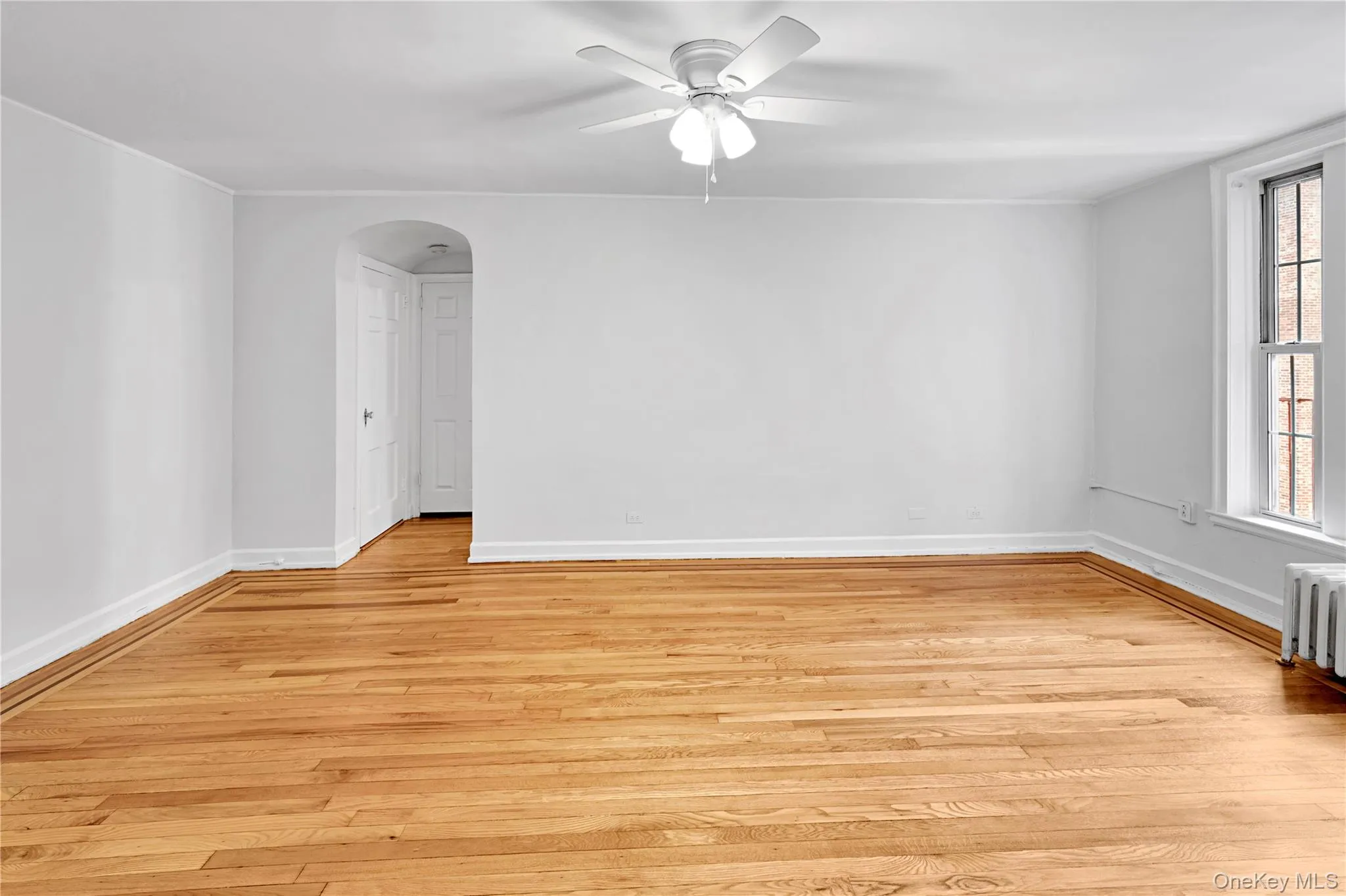 Living Room with refinished hardwood floors and freshly painted Living Room with refinished hardwood floors and freshly painted