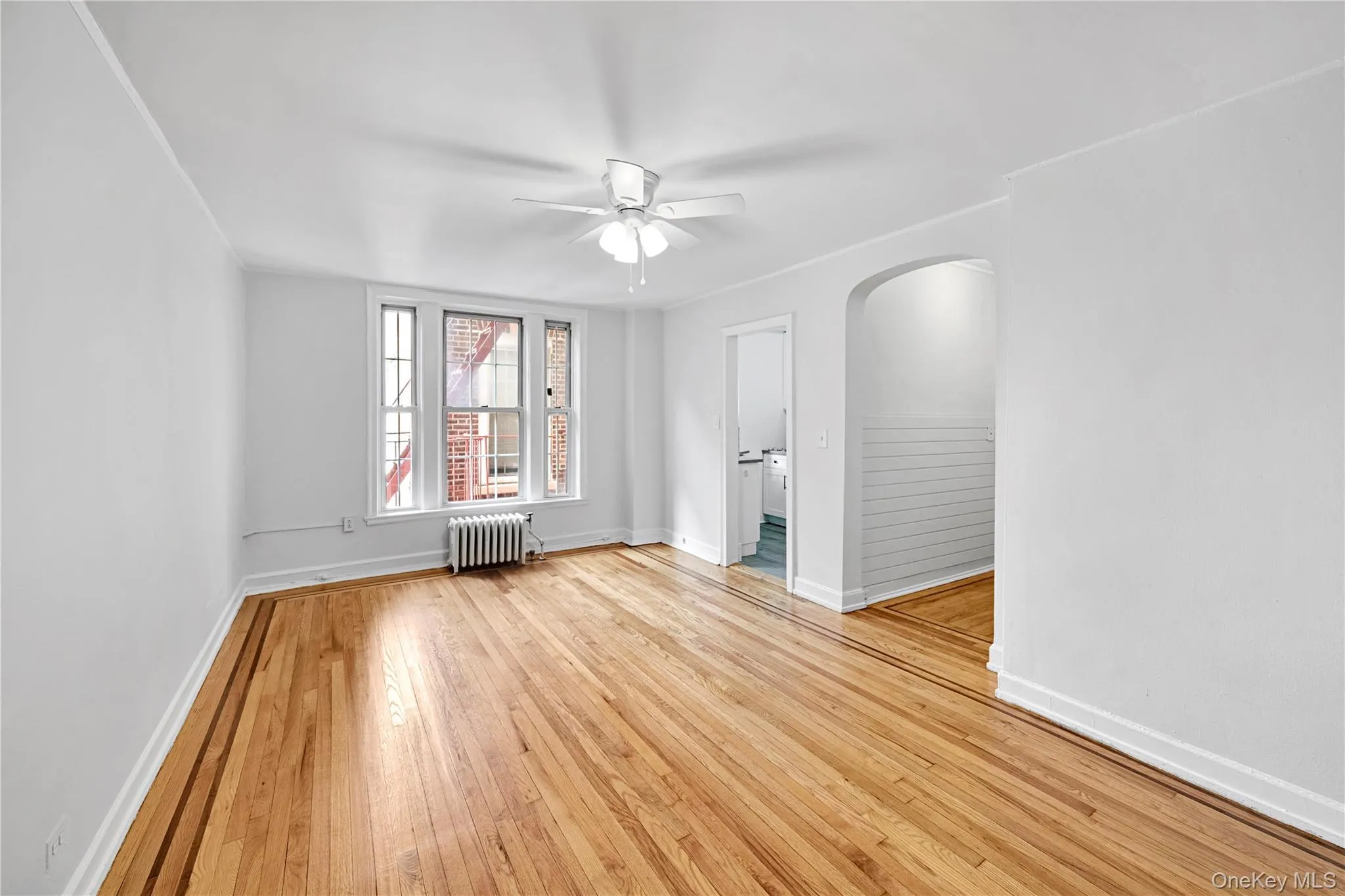 Living Room with refinished hardwood floors and freshly painted Living Room with refinished hardwood floors and freshly painted