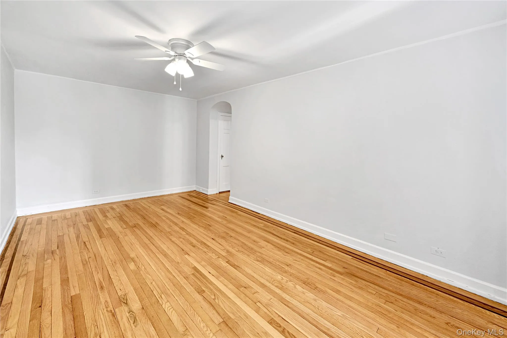 Living Room with refinished hardwood floors and freshly painted Living Room with refinished hardwood floors and freshly painted