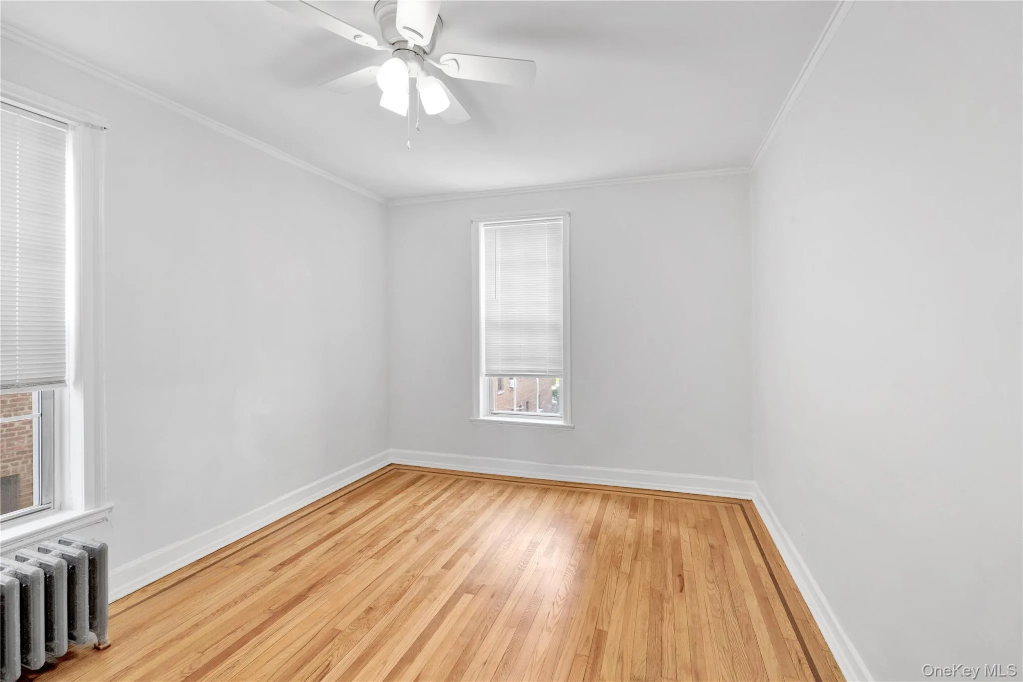 Bedroom with refinished hardwood floors and freshly painted Bedroom with refinished hardwood floors and freshly painted