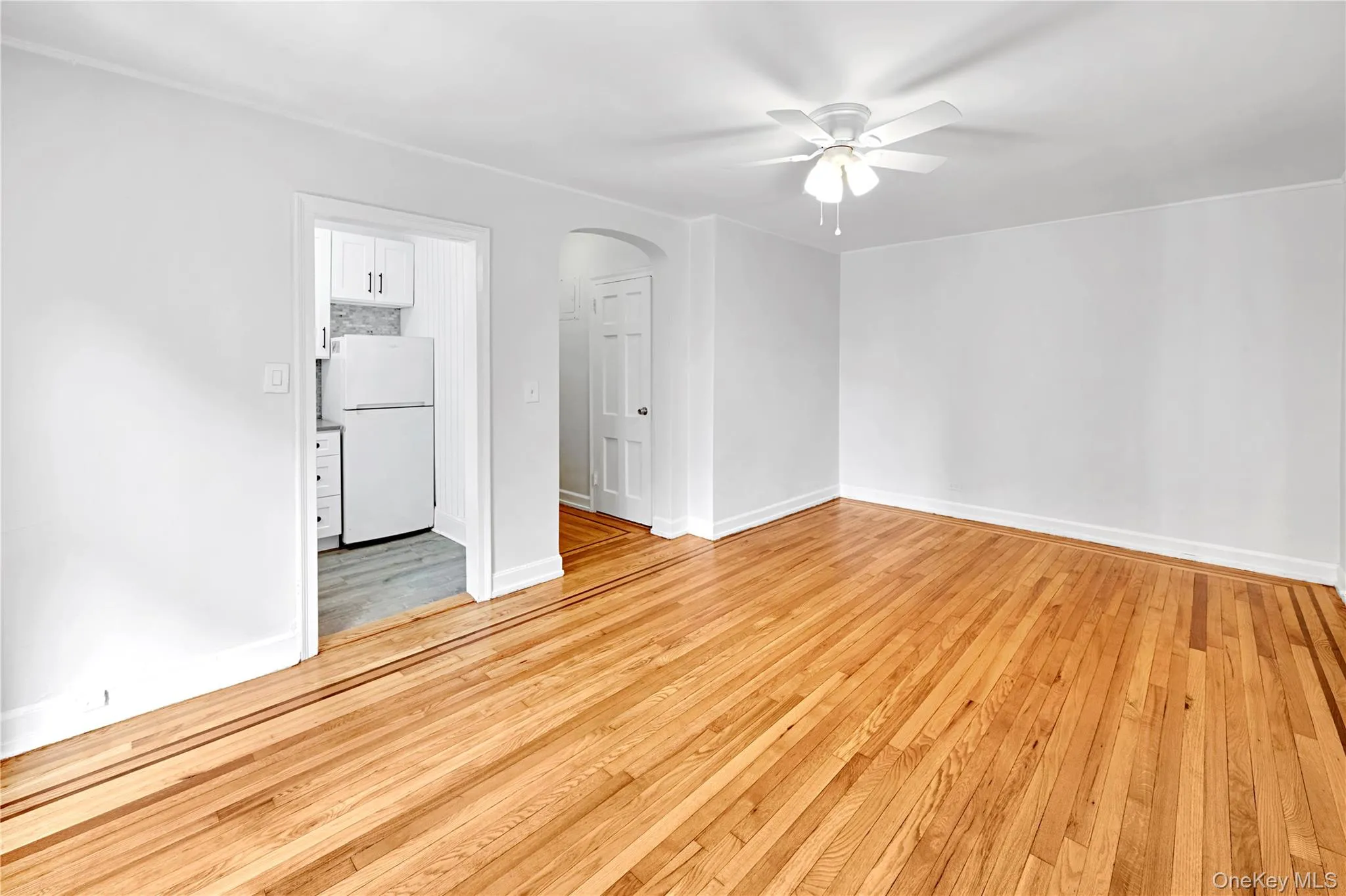 Living Room with refinished hardwood floors and freshly painted Living Room with refinished hardwood floors and freshly painted