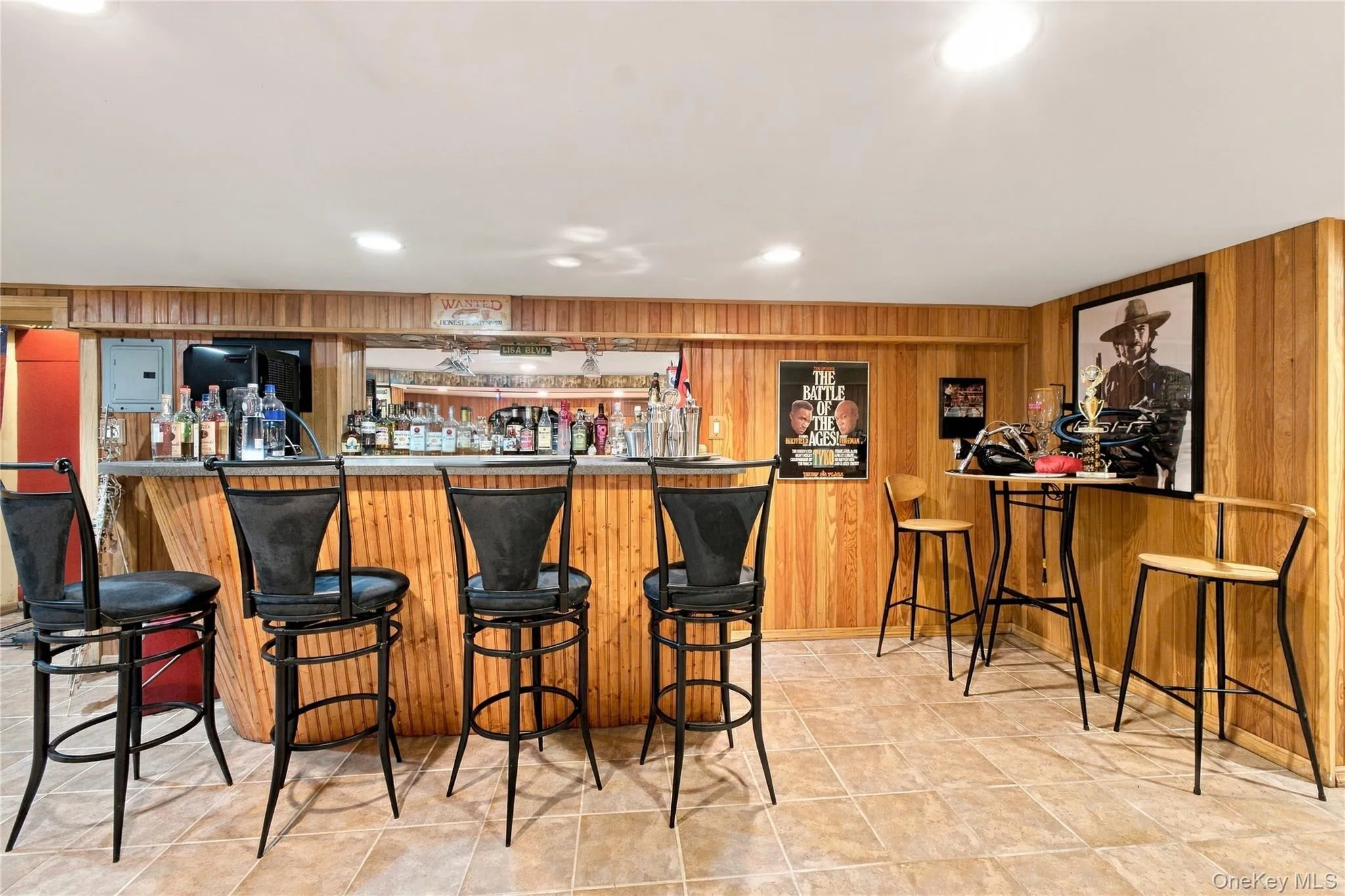Wet bar in the basement with ceramic tile floors Wet bar in the basement with ceramic tile floors